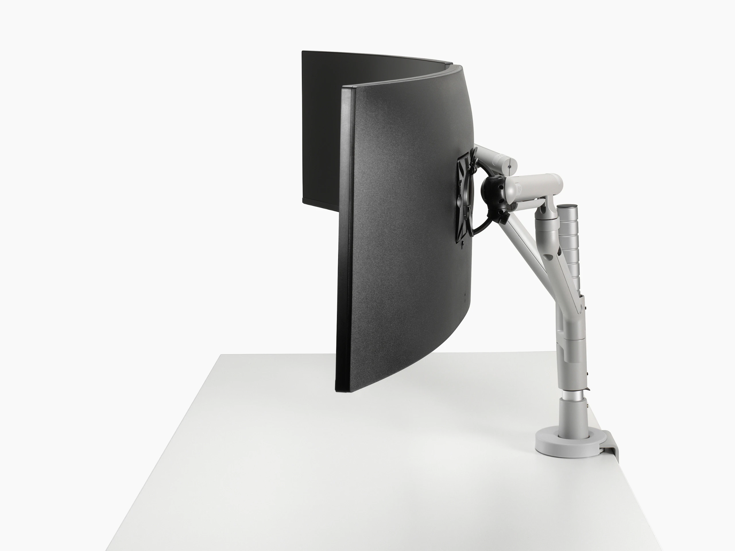 Flo Modular dual monitor arms silver, viewed from the side.