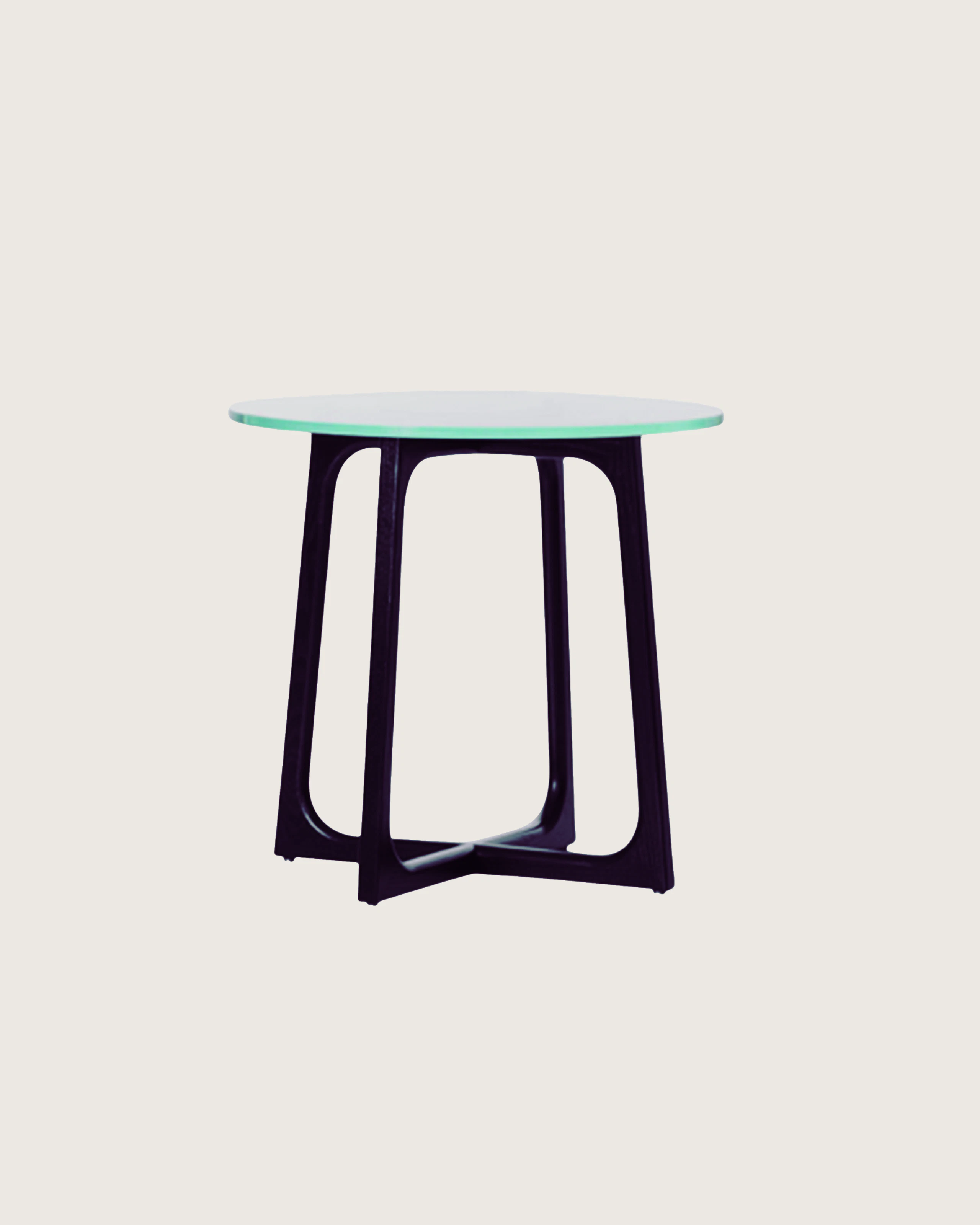 A square Loophole coffee table with a glass top and walnut base.