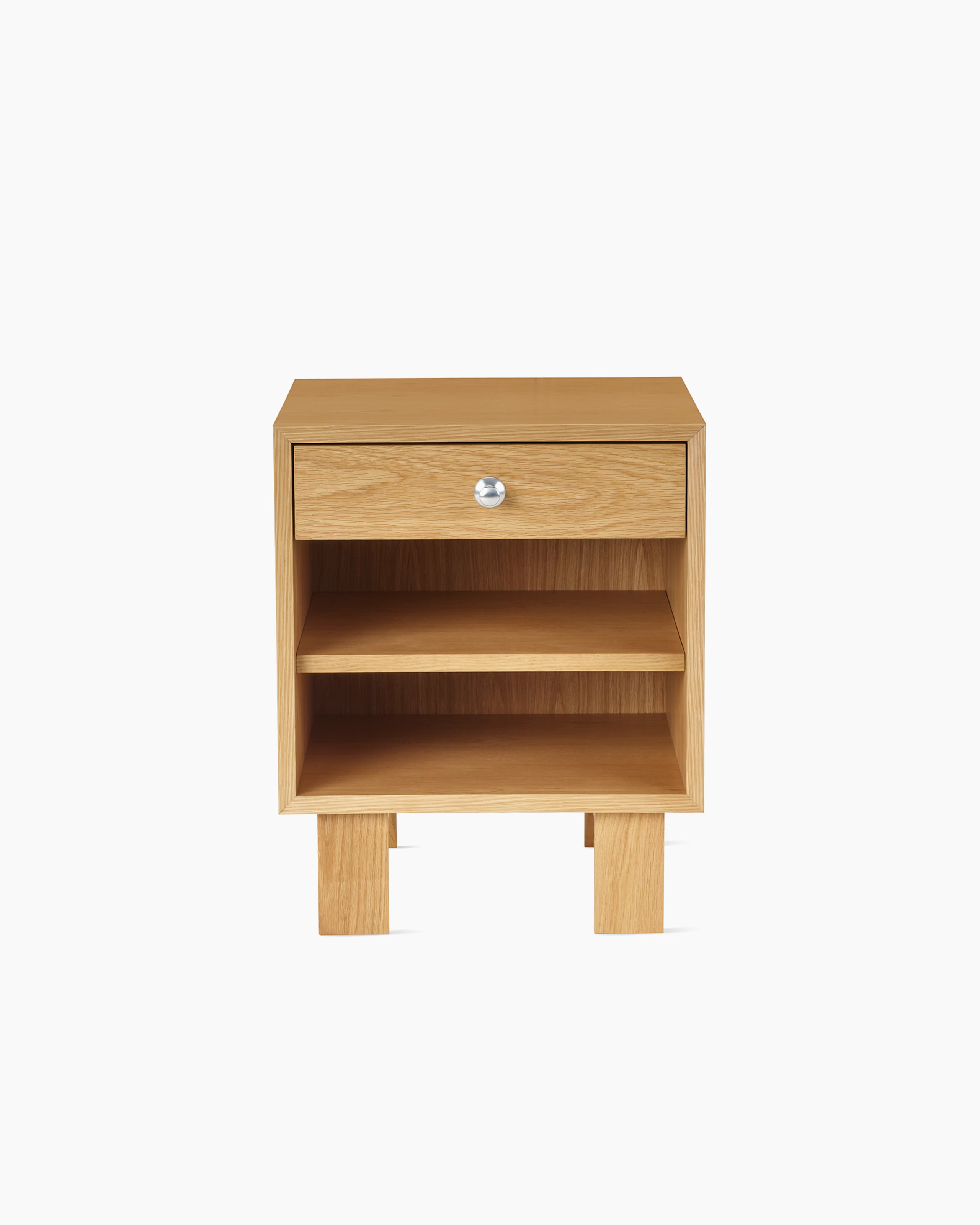 Nelson Basic Cabinet Series Bedside Table with one drawer, aluminum pull, open shelf, standard square legs, in natural oak.