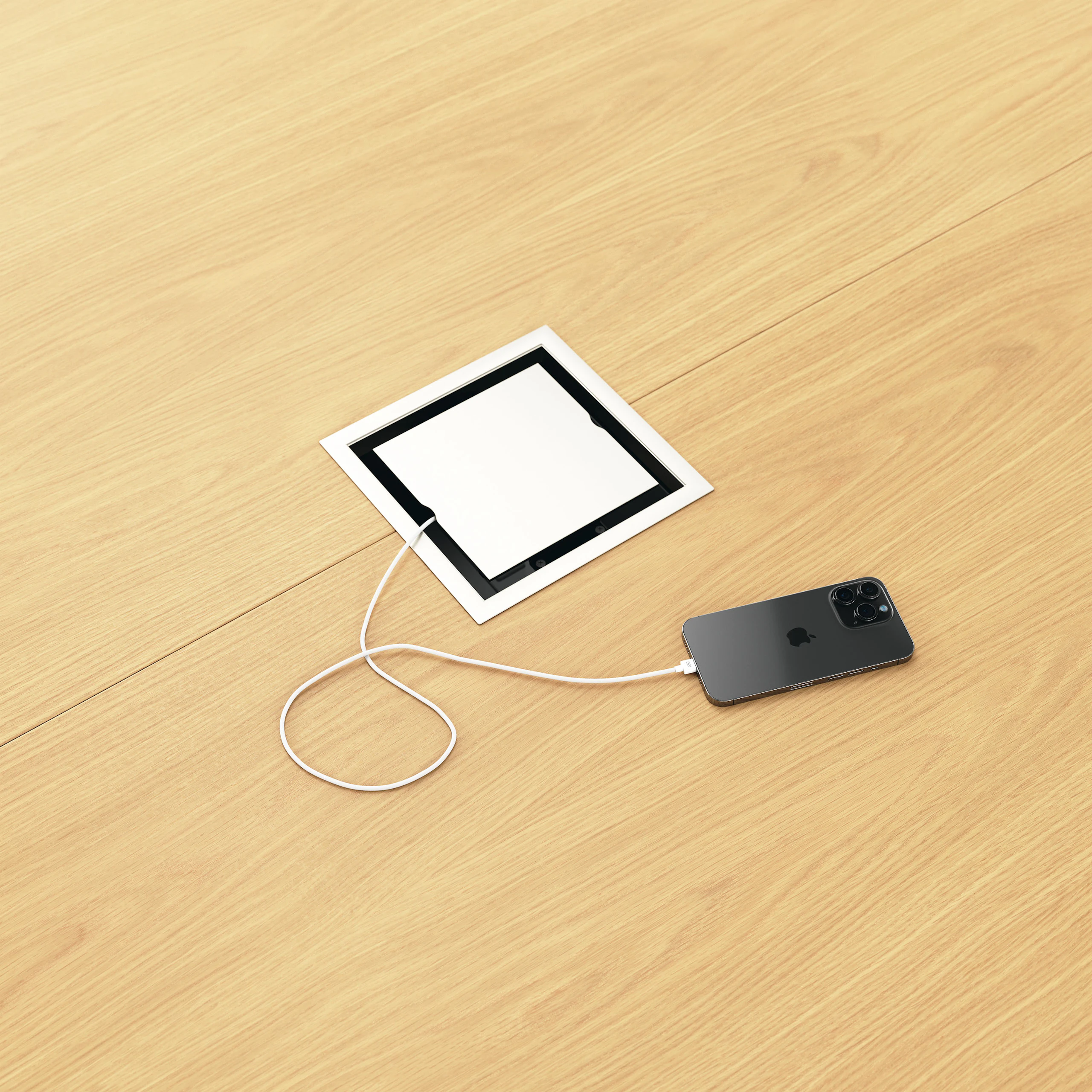 Detail shot of closed tabletop power access on a Circular Highline Meeting Table in Natural Flat Cut Oak and Satin Nickel.
