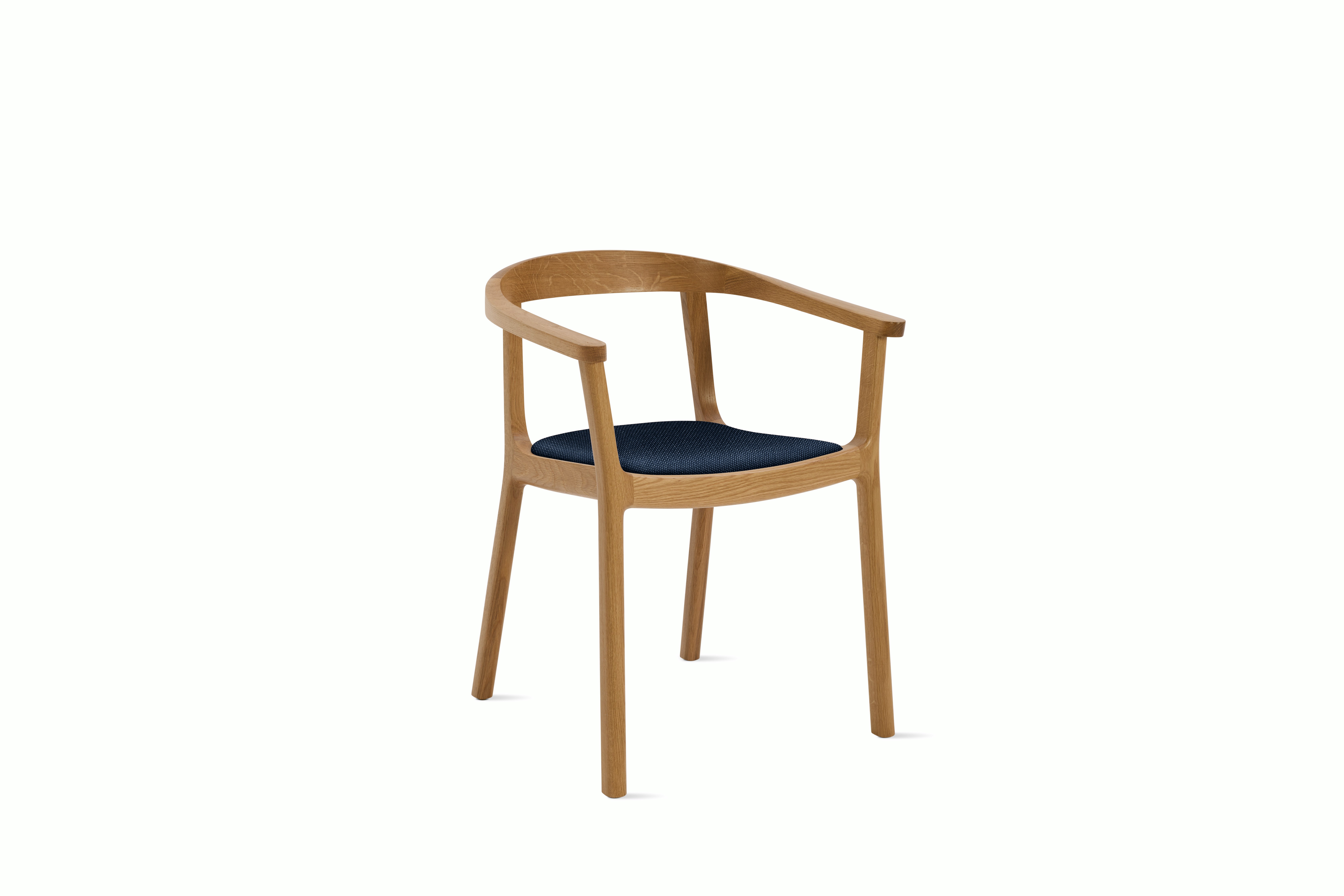 A Lijn Armchair in Society Oak viewed from an angle.