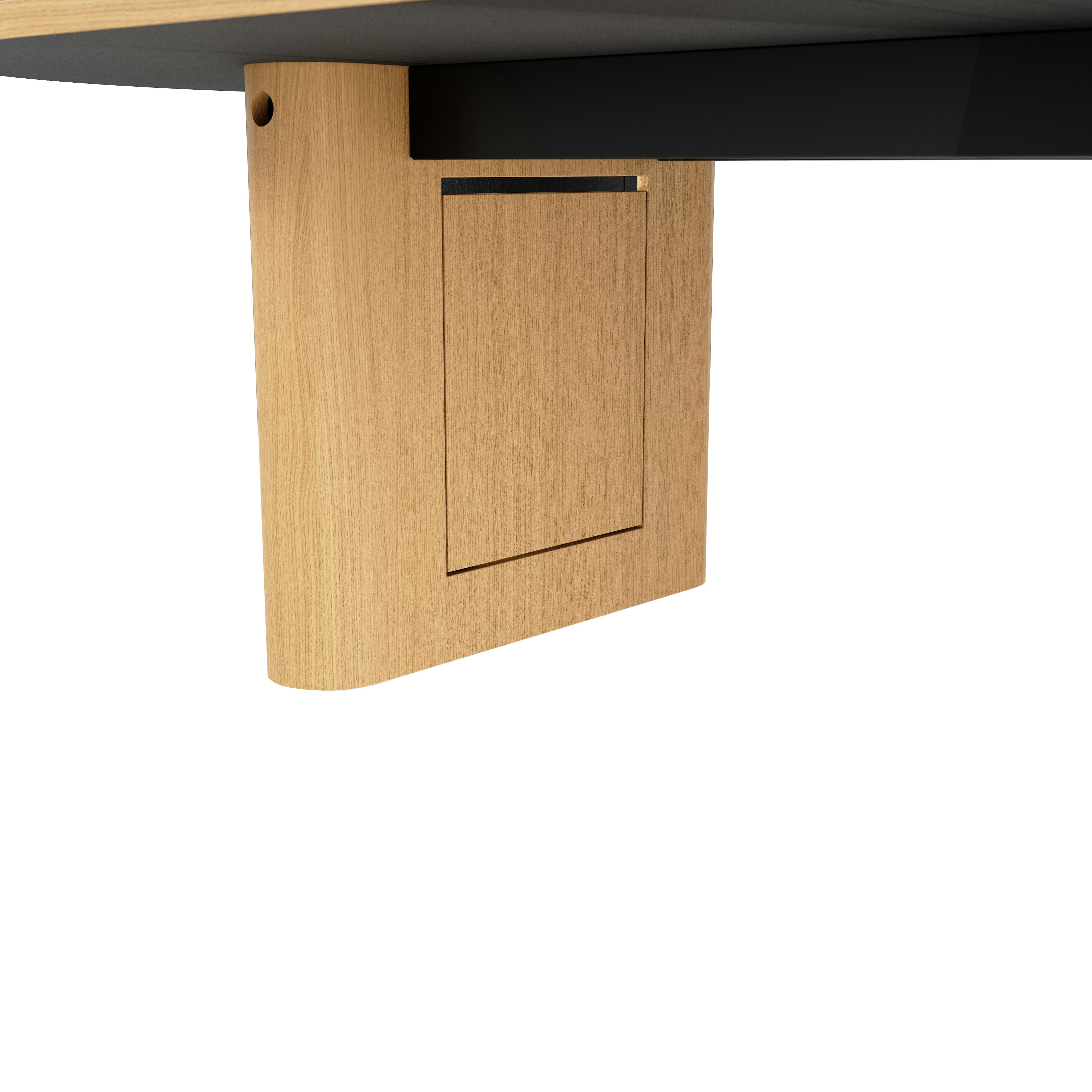 Detail shot of closed wire management leg on JD Conference Table in Natural Rift Cut Oak with a racetrack-shaped base.