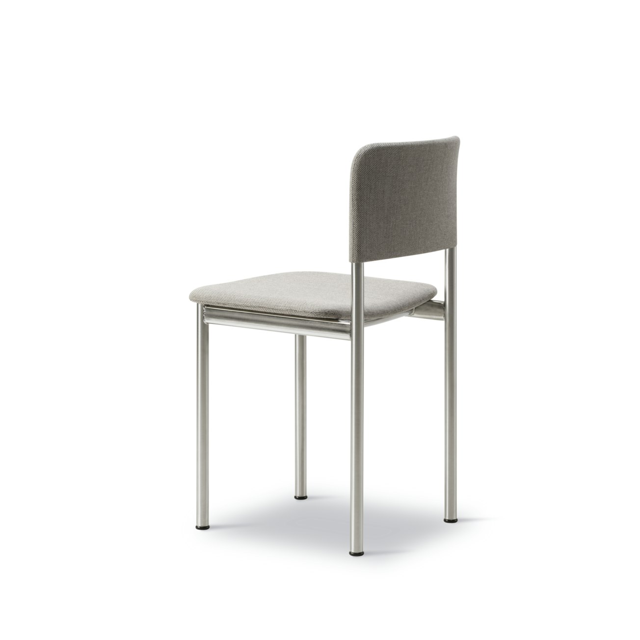 A Plan Side Chair in Brushed Steel viewed from an angle.
