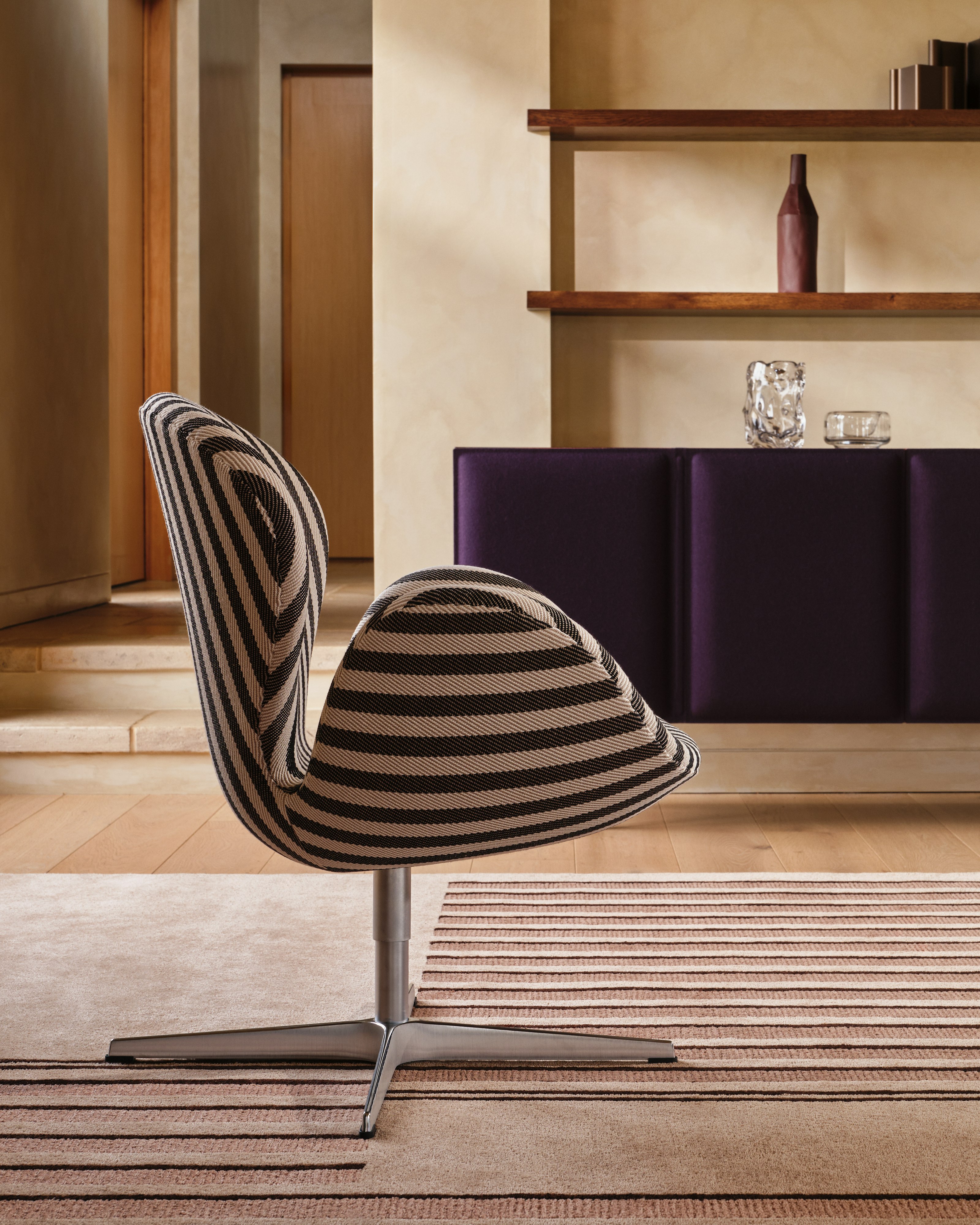 Swan Chair with Tacito Sideboard and Semita Rug  in a living room