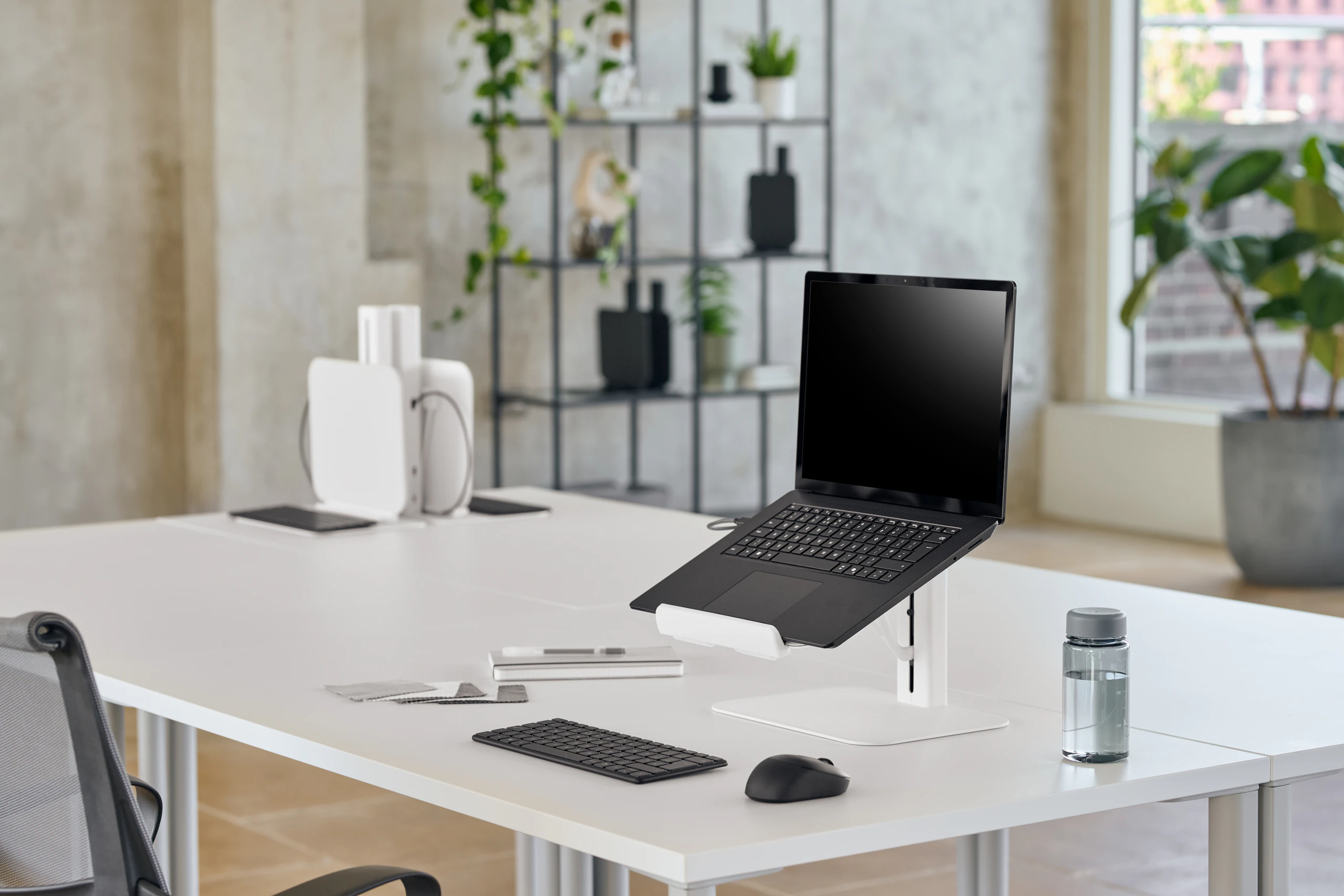 White Lana laptop stand angle viewed in a working environment.