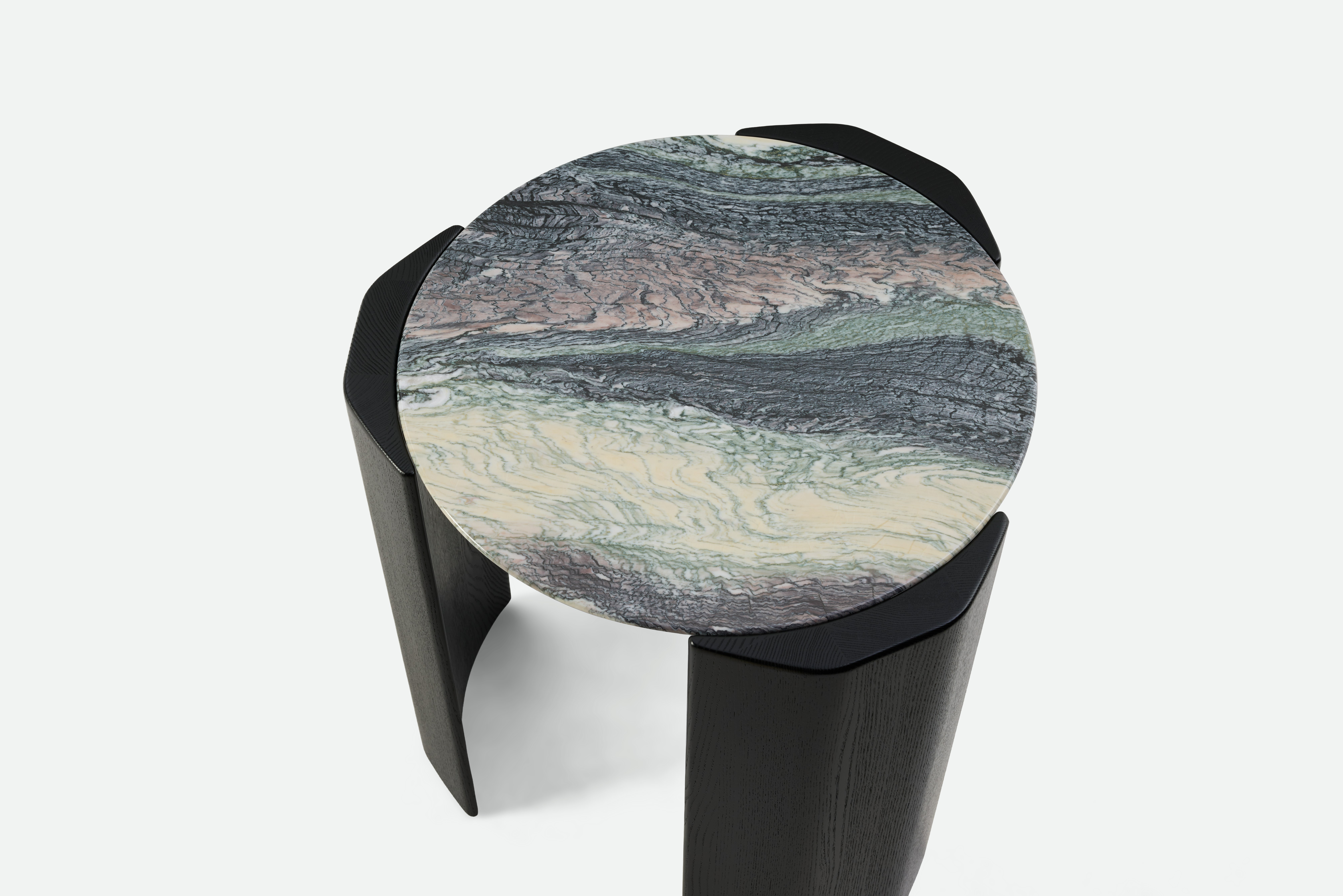 A detailed view of the Atlason Organic Slab Side Table in Black Ash.