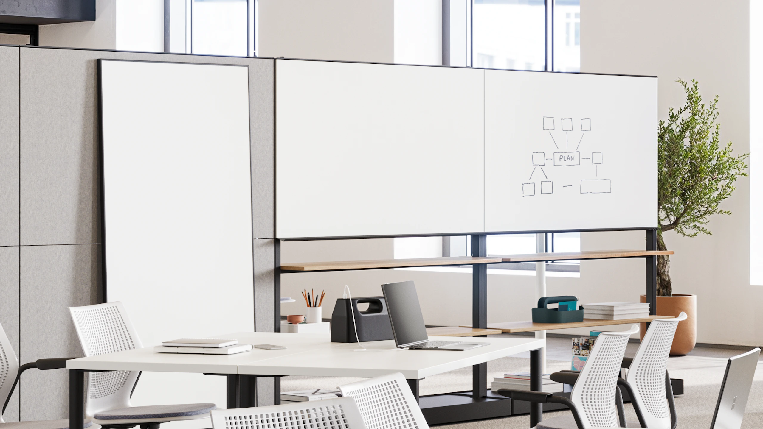 A forum space furnished with Herman Miller OE1 Agile Walls and Fuld Nesting Chairs used to adapt spaces to help support flexibility in a community setting