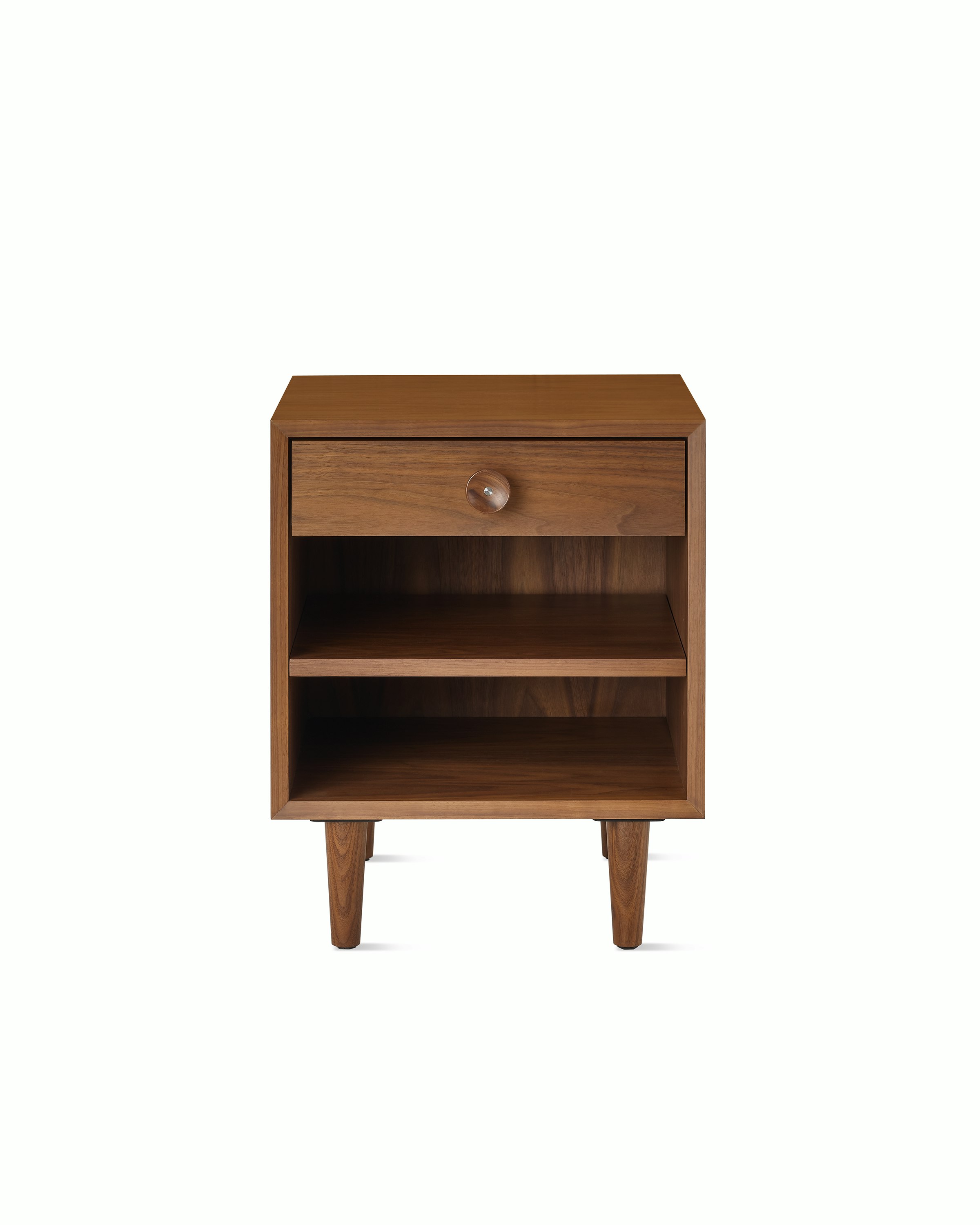 Nelson Basic Cabinet Series Bedside Table with one drawer, cupcake pull, open shelf, taper legs, in walnut.