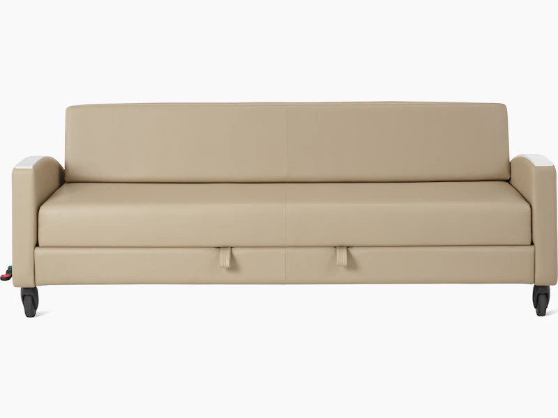 Gemma Double Sleep Sofa with central brake and steer casters and curved armrests. Viewed from the front.