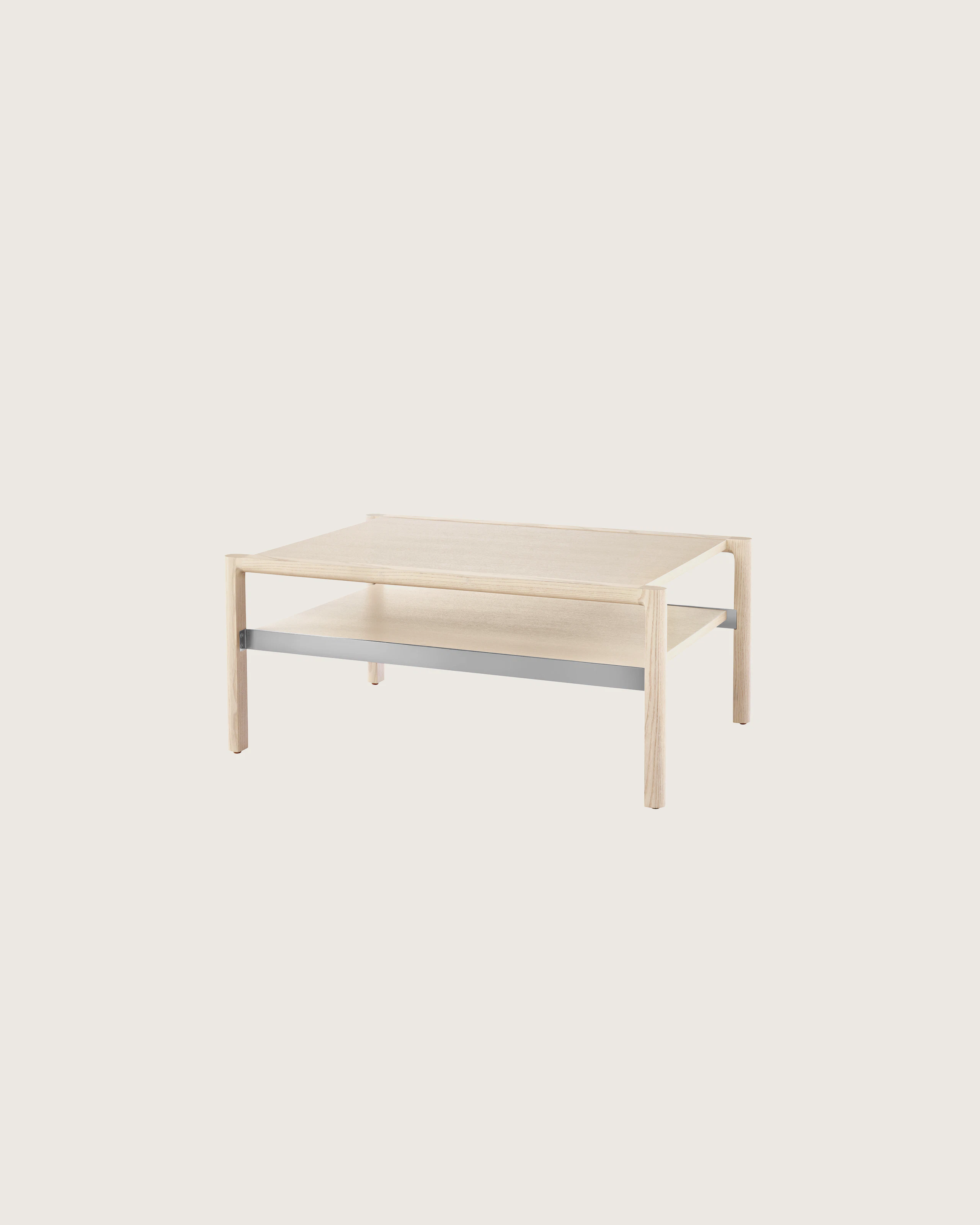 A rectangular Brabo Table with a wood top and shelf and metal frame supports, viewed at an angle.