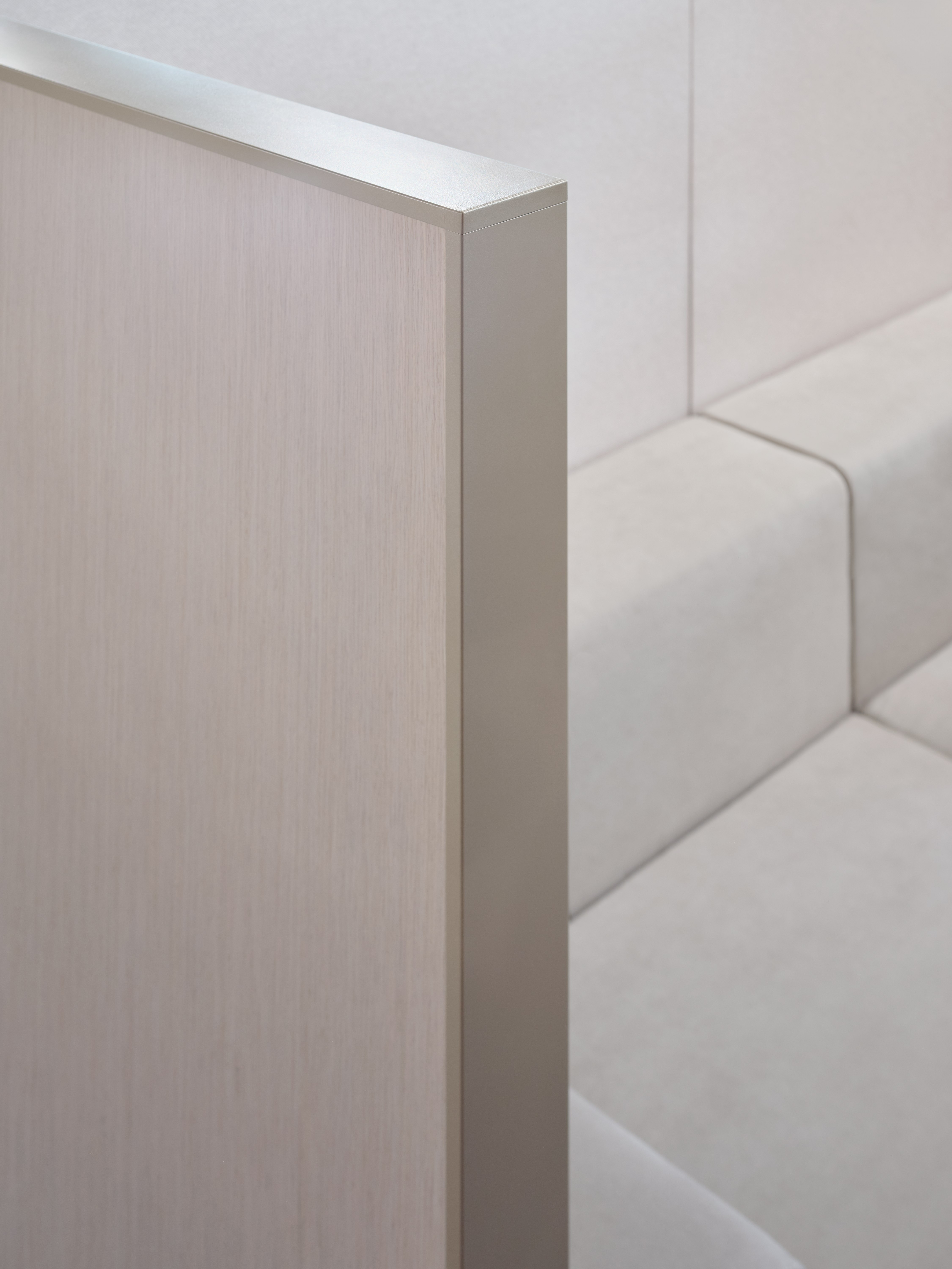 This is a detail view of panel aluminum trim with lounge seating in the background.