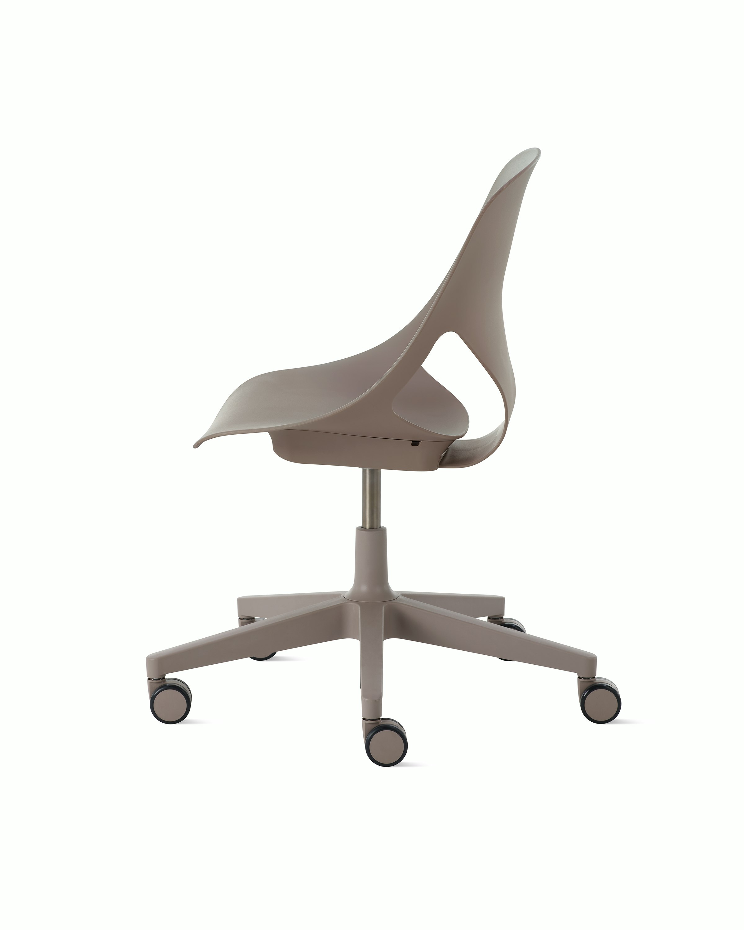Side view of a light brown armless Zeph chair.