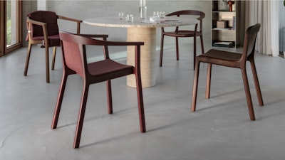 Four brown Lijn Chairs from Geiger placed around a round table