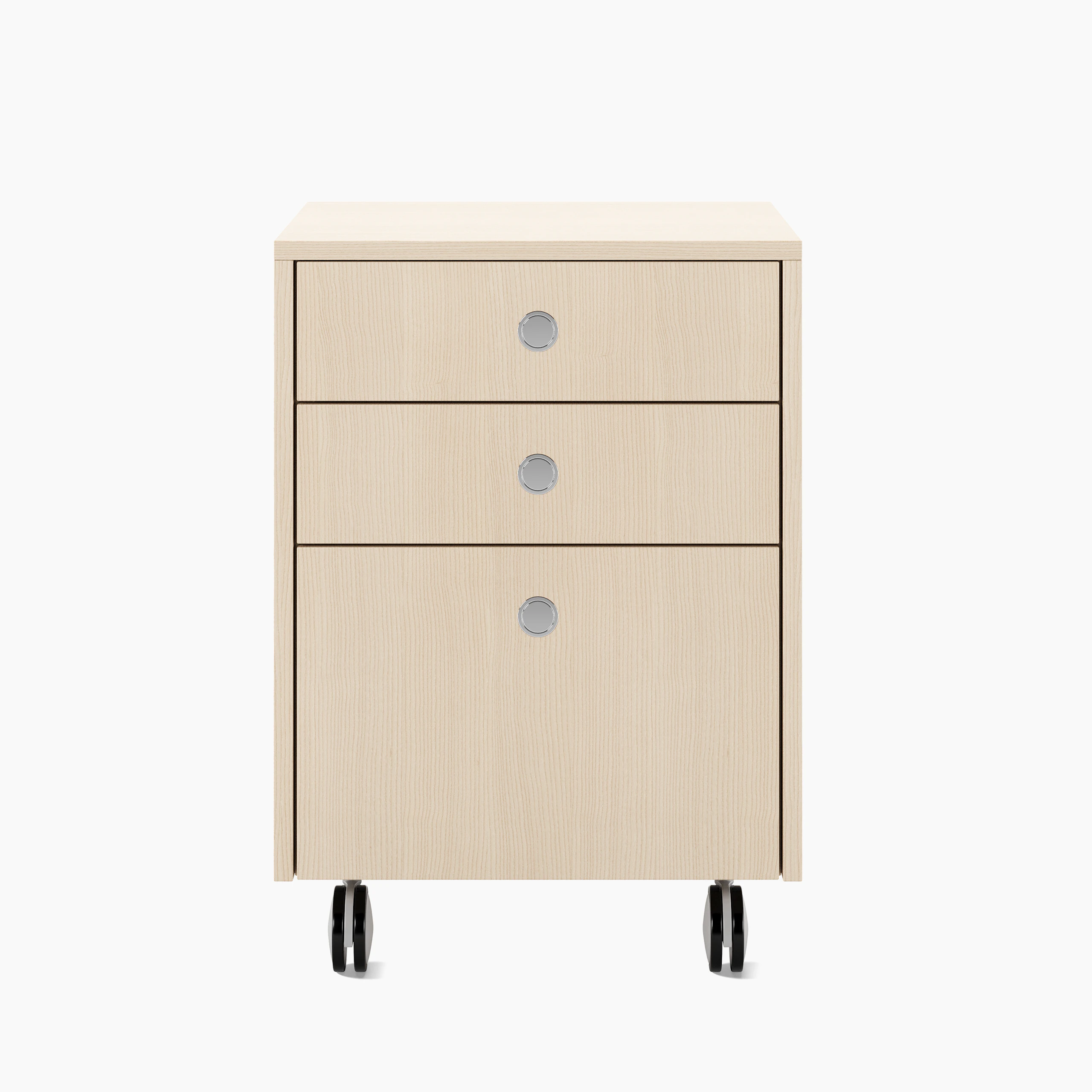 Sled Base Mobile Pedestal in ash with three drawers and chrome pulls on casters viewed from the font.