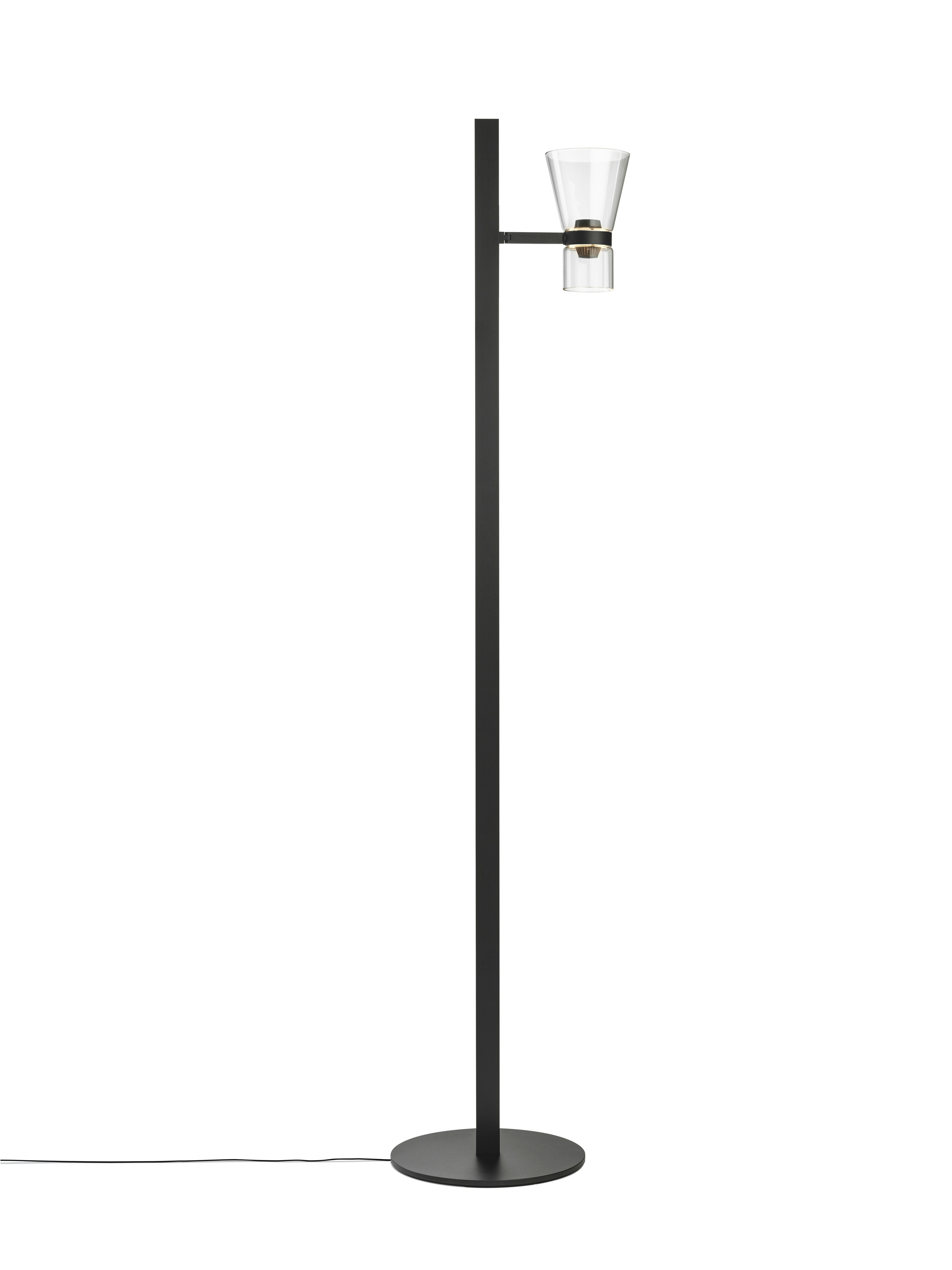 A Nocturne Floor Lamp in F1 Cone, Black viewed from behind.