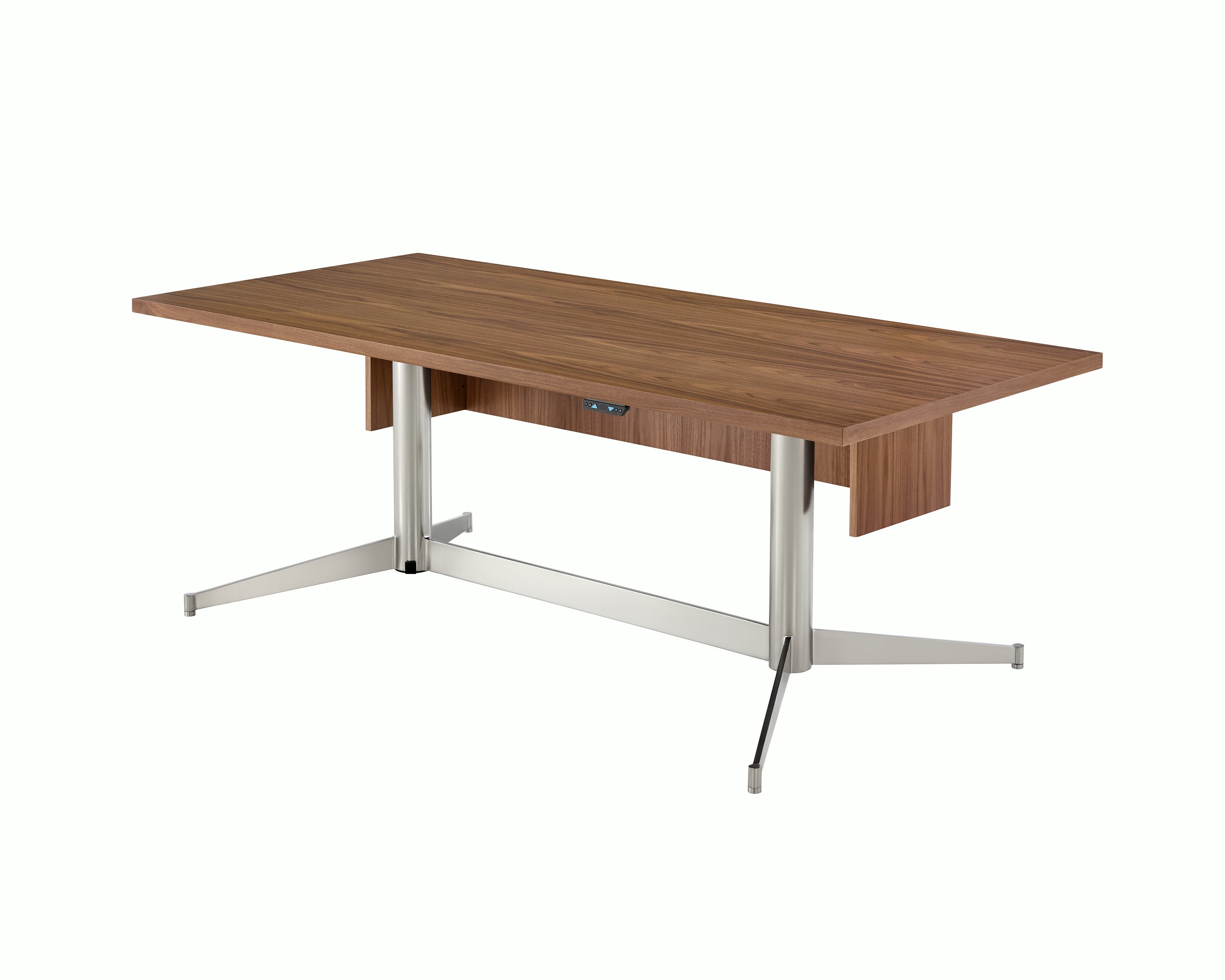 A rectangular MP Height-Adjustable Table in the seated position, viewed from an angle and showing the height-adjustment button beneath the tabletop.