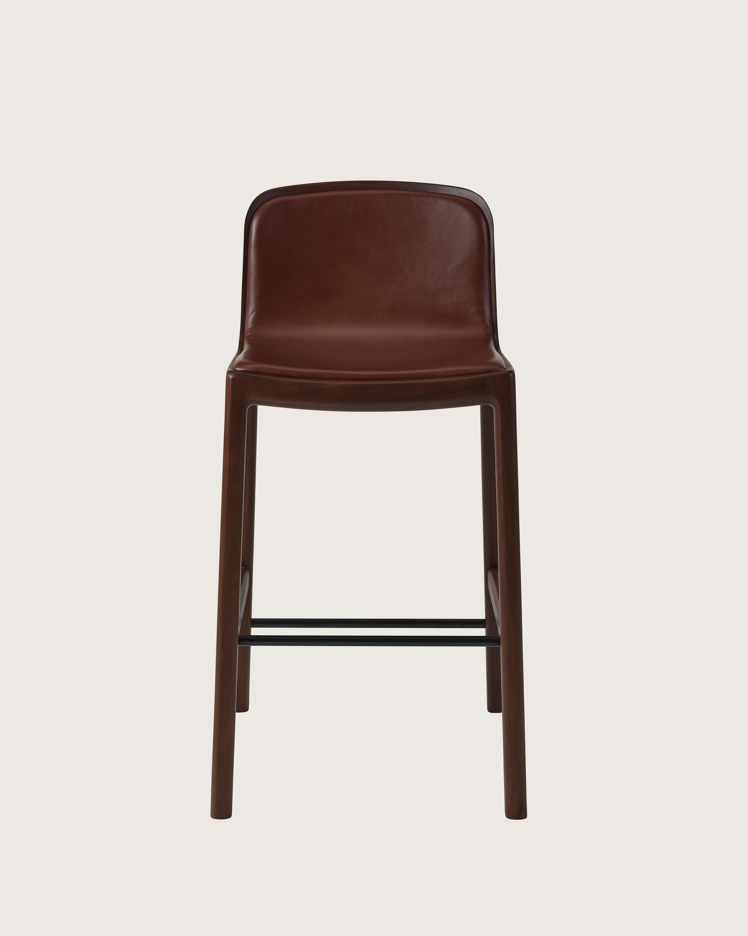 Lijn Stool by Carole Baijings for Geiger in Persian Walnut frame upholstered with Maharam Hue Leather in Bittersweet, front view on a white sweep.
