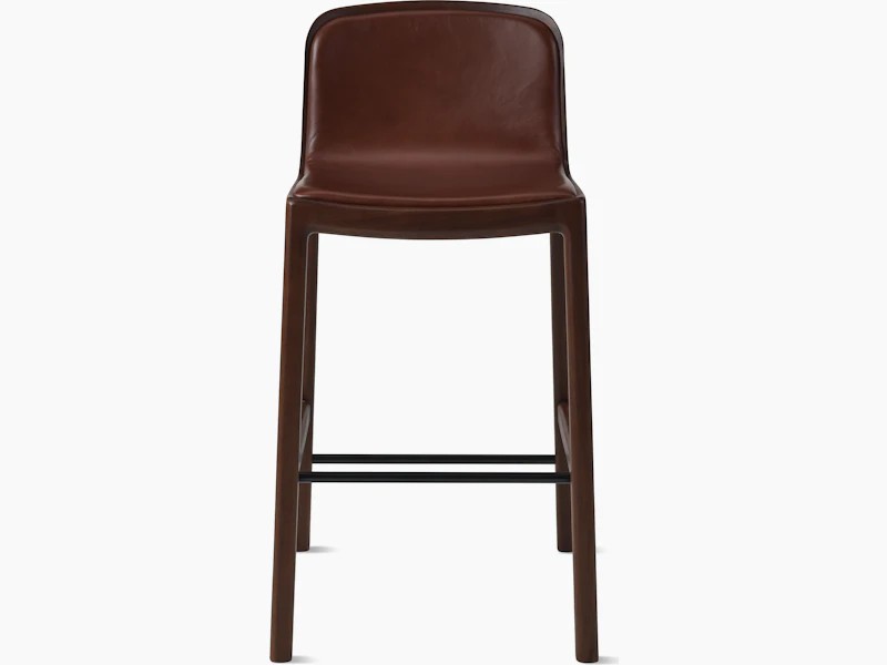 Lijn Stool by Carole Baijings for Geiger in Persian Walnut frame upholstered with Maharam Hue Leather in Bittersweet, front view on a white sweep.