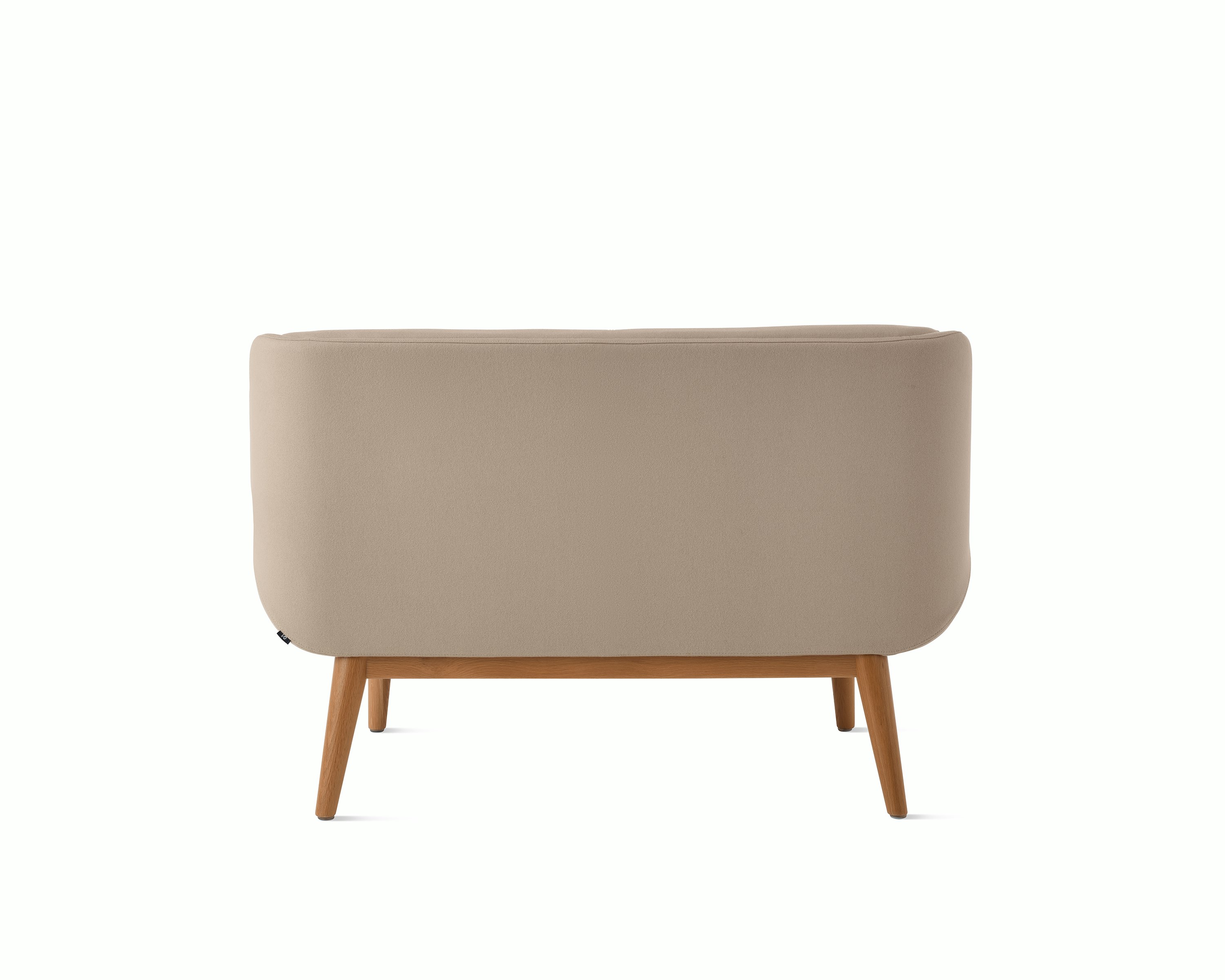 White background shot of Hush Sofa with taupe fabric and wooden base.