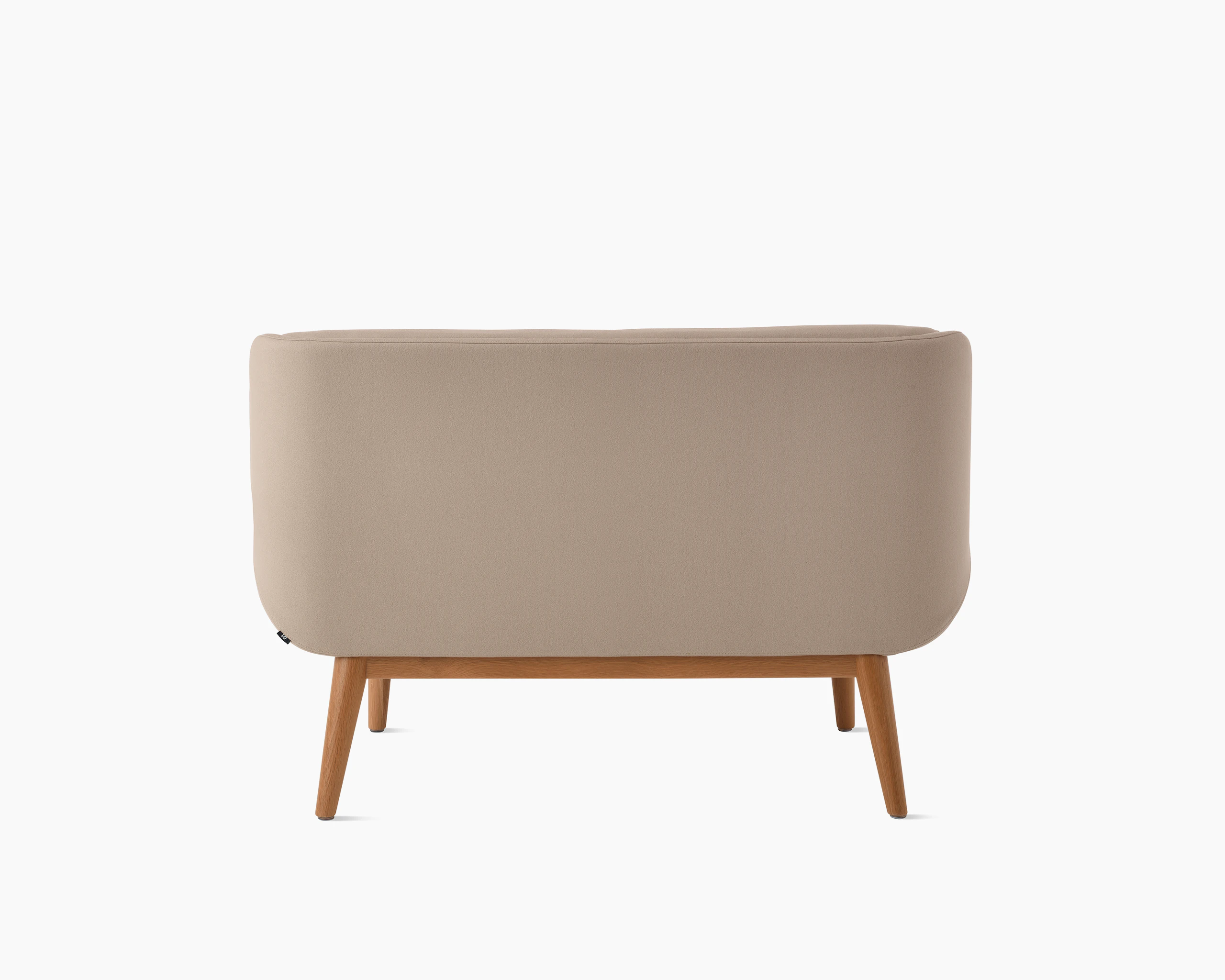 White background shot of Hush Sofa with taupe fabric and wooden base.
