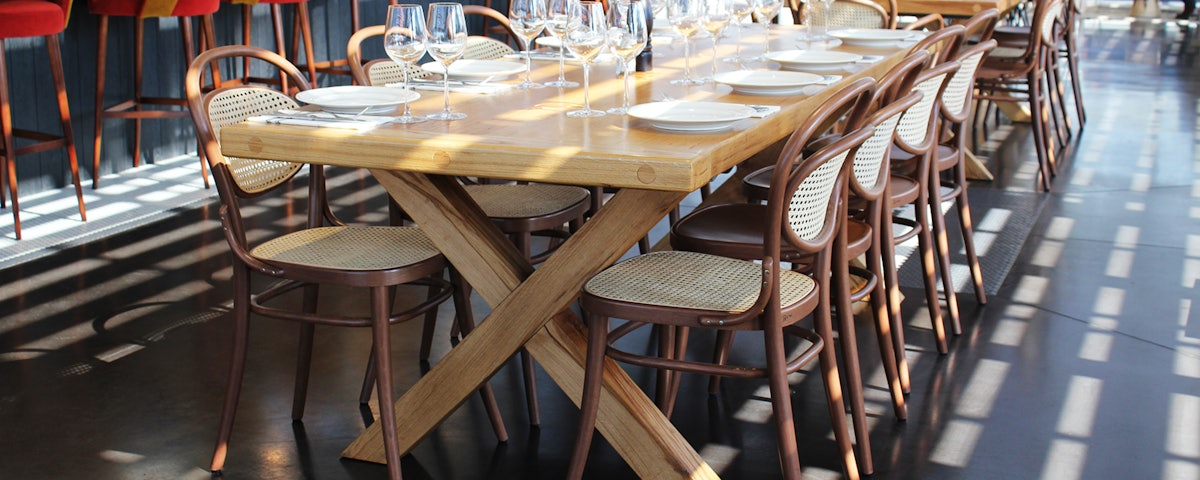 Multiple 20 Side Chairs surrounding a dining table in a restaurant dining room setting