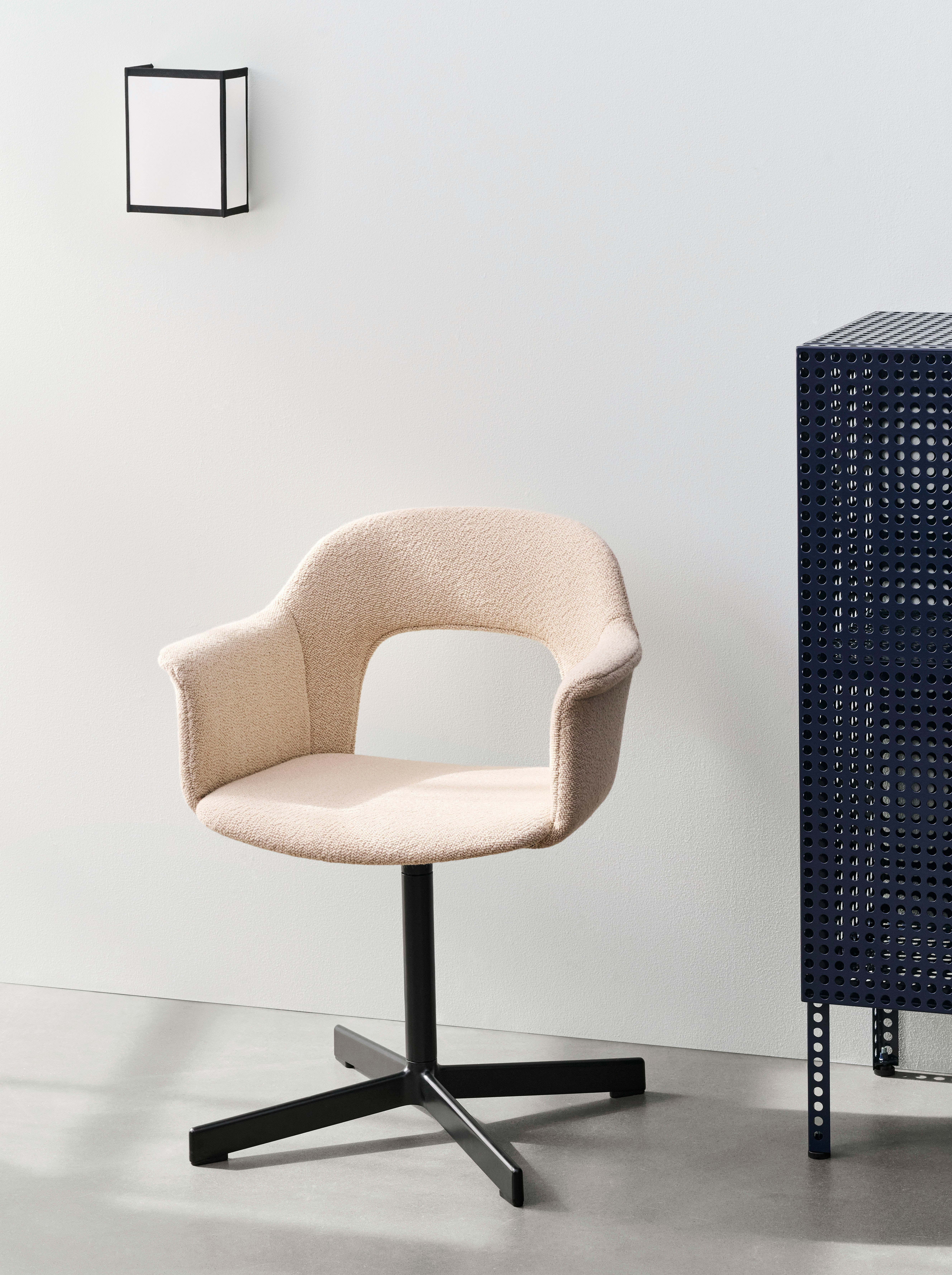 Layout Armchair 234, fully upholstered in blush fabric, with 4-star swivel base in a soft setting.