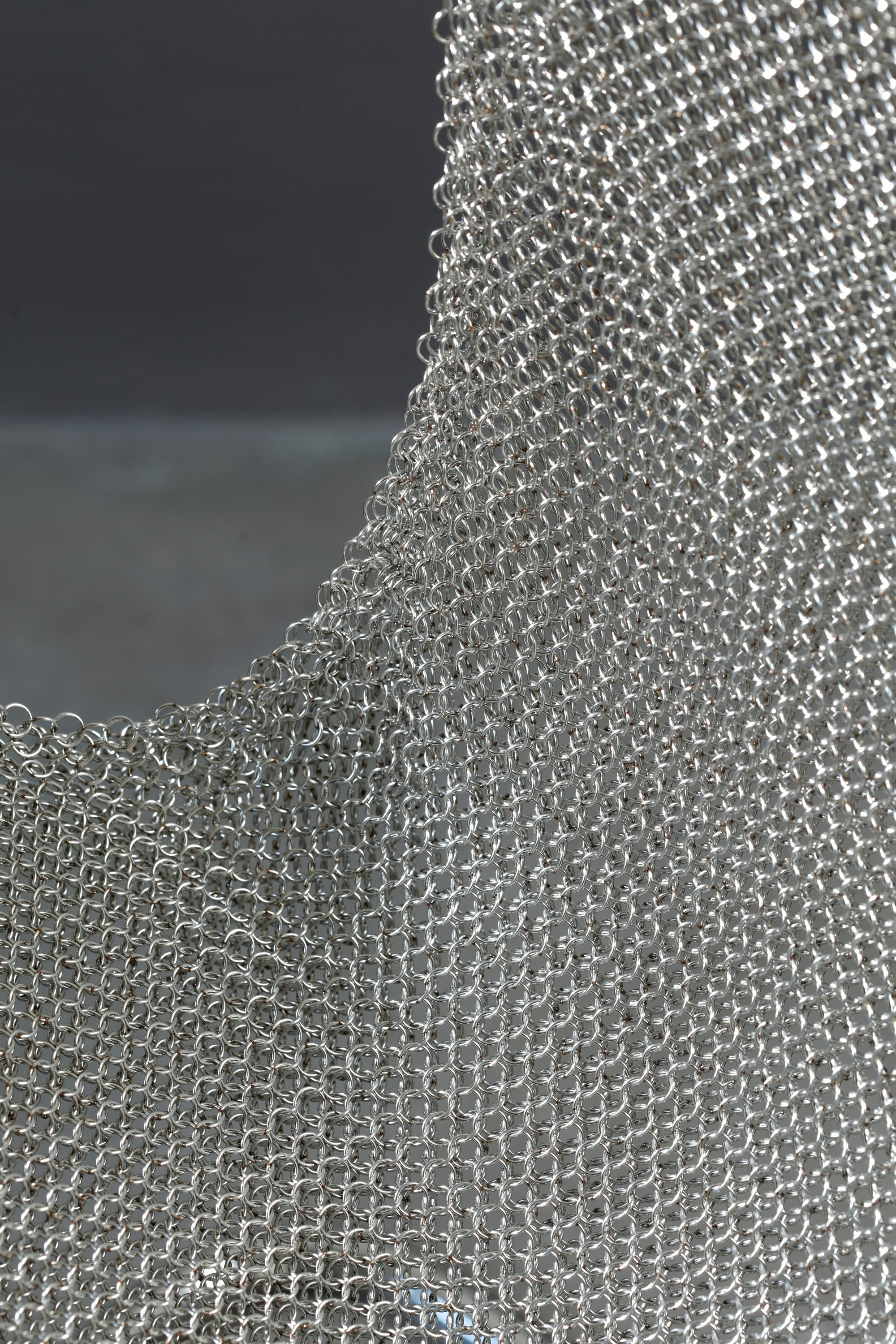 Environmental shot of Paulistano Armchair in Silver Mesh, Stainless Steel.