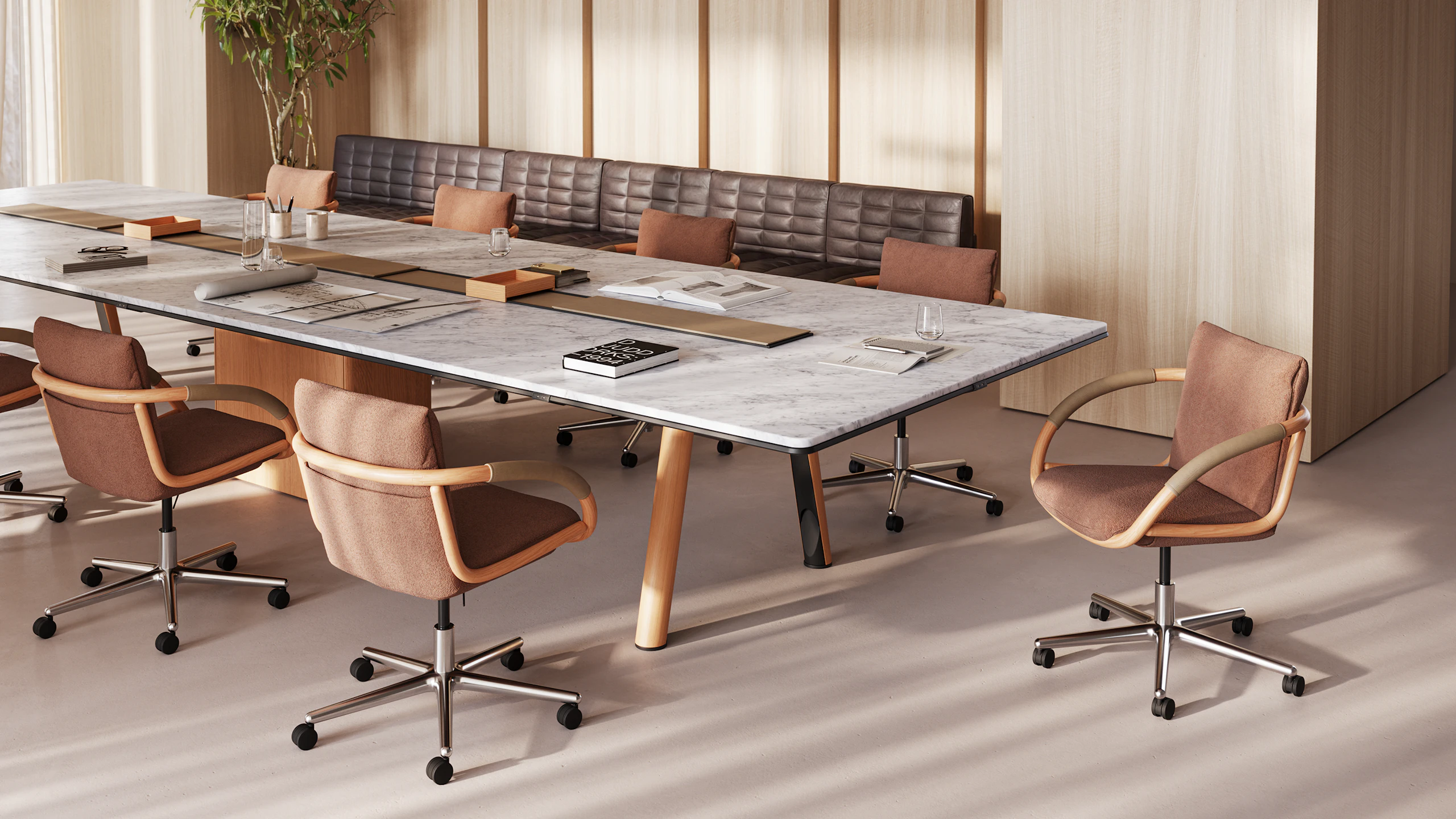 Ascent Conference Table with Full Loop Chairs, designed by EOOS, shown in White Carrara Marble with a Natural Rift Cut Oak base, viewed at an angle in a boardroom setting.