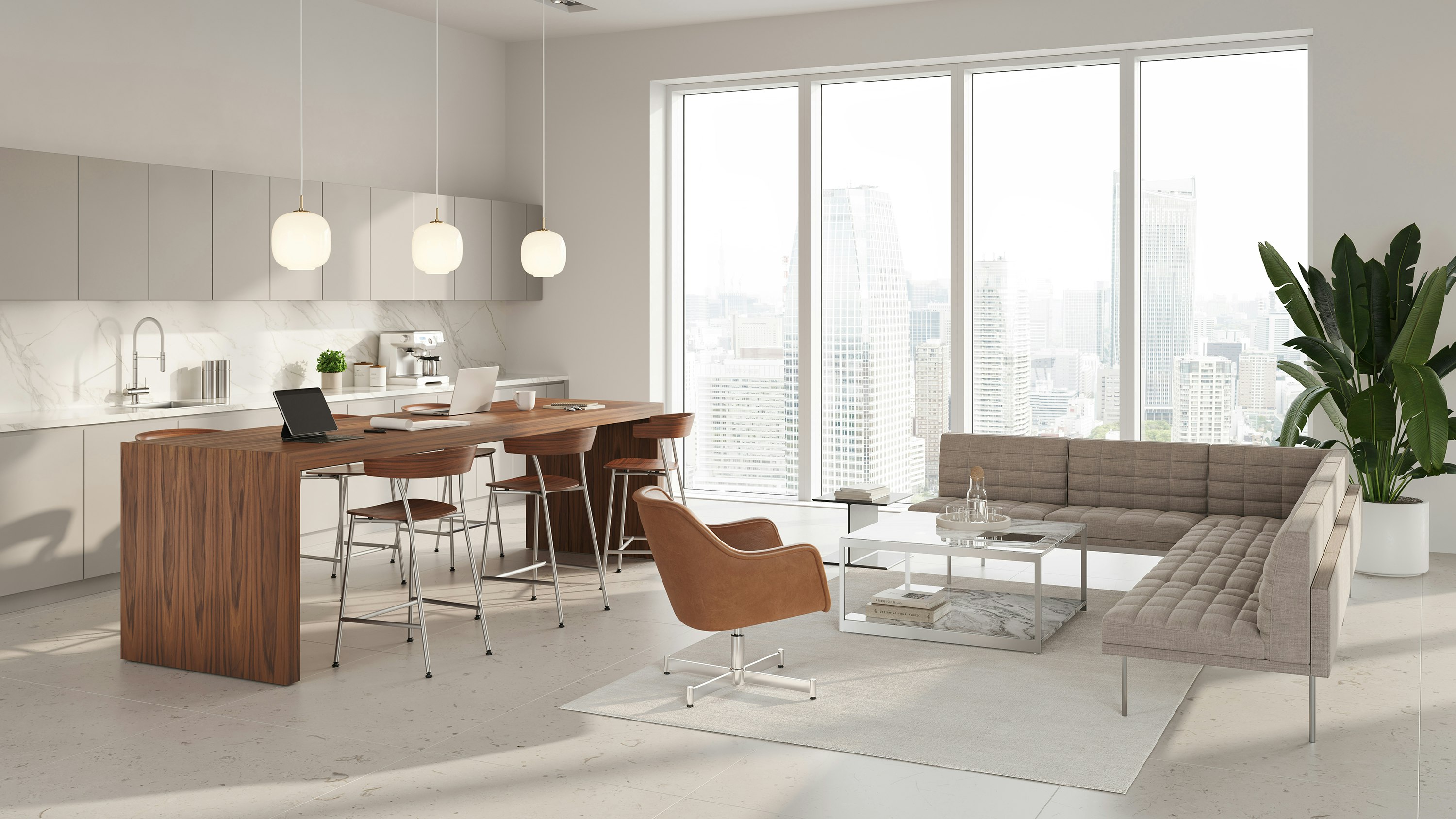 An environmental image of the JD Waterfall Table in an office kitchen setting. With Leeway Stools, Tuxedo Sofa and Bumper Lounge Chair reception area.