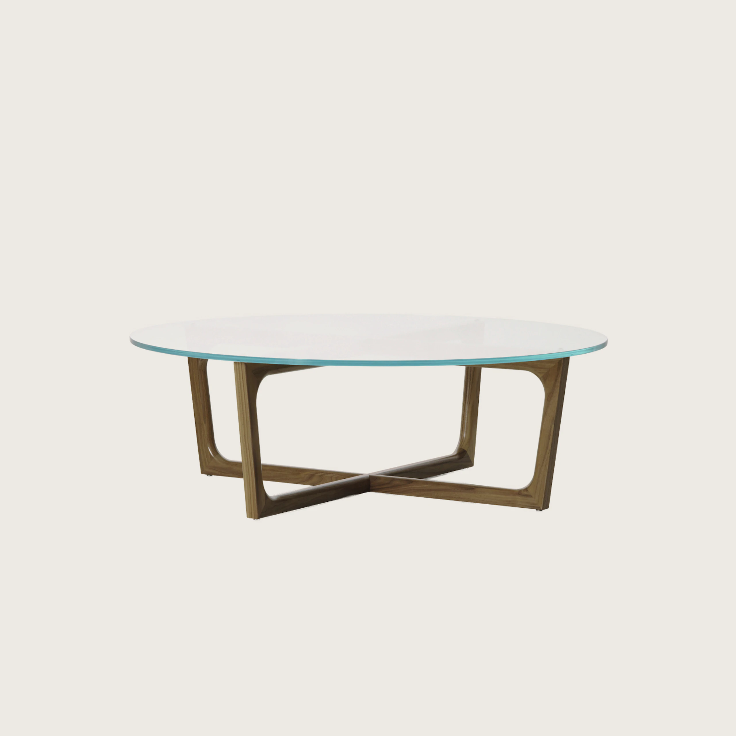 A round Loophole coffee table with a glass top and a walnut base.