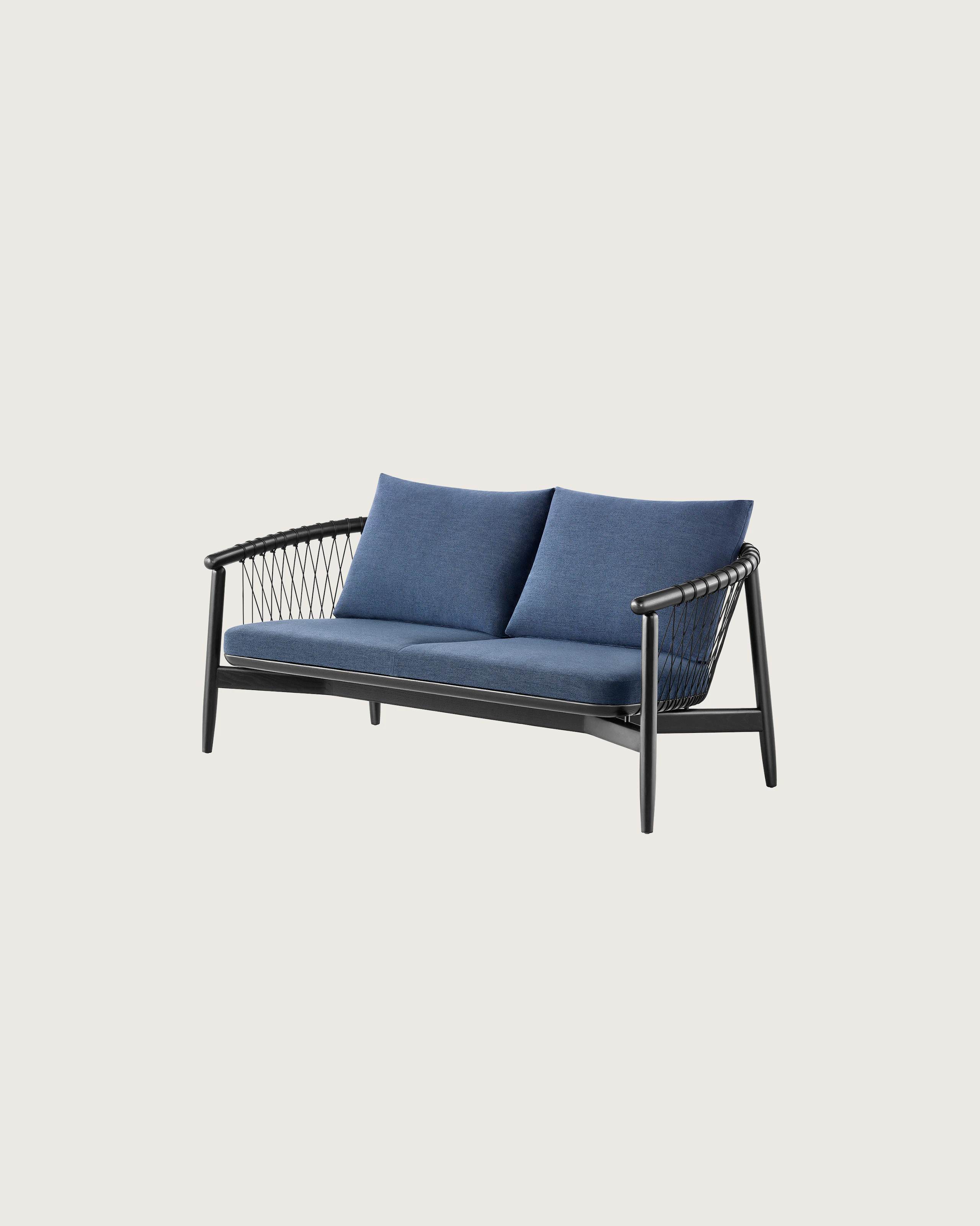 A dark colored Crosshatch Settee featuring navy upholstery and an ebony on ash frame. Viewed at an angle.