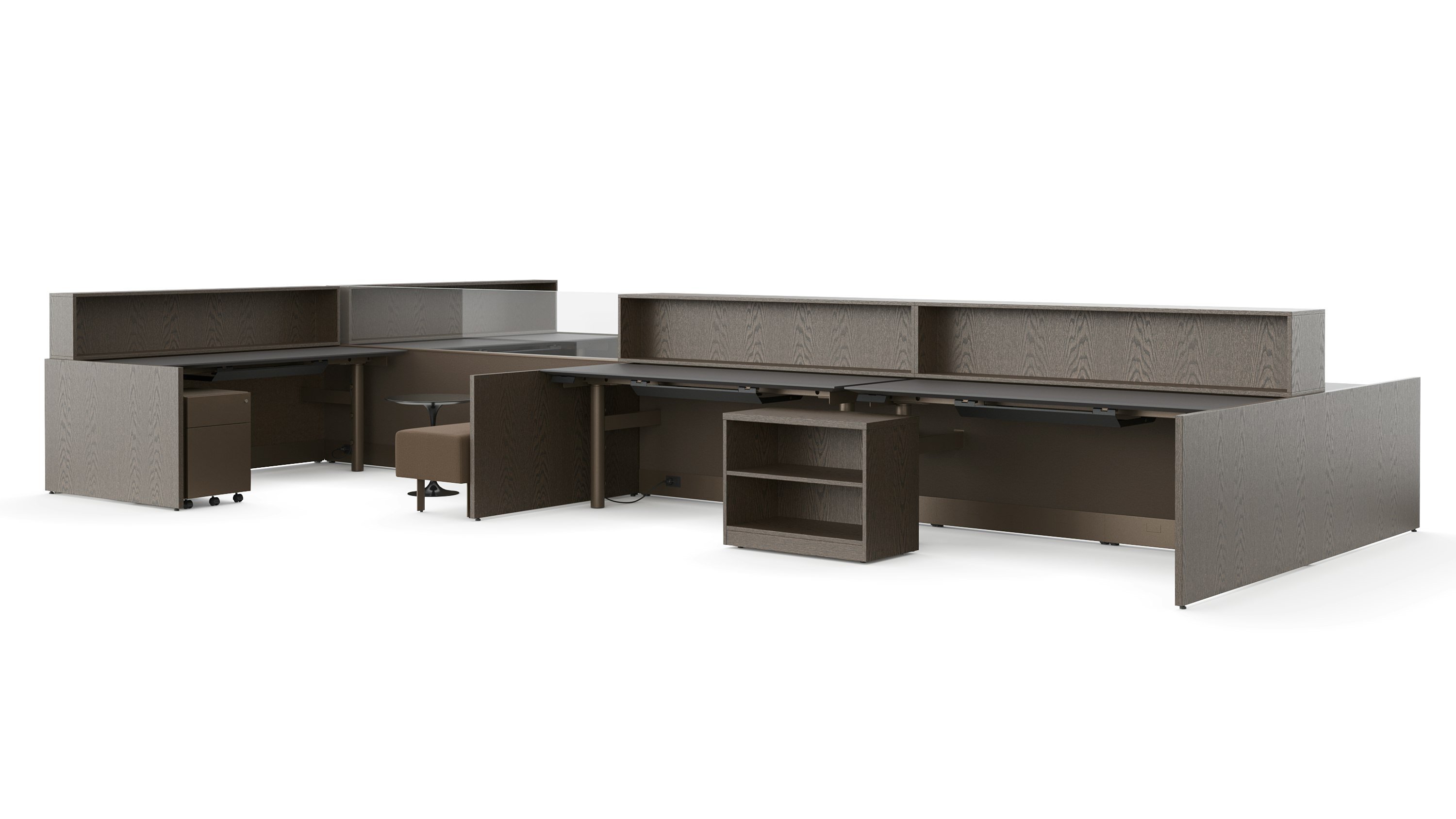 A group of workstations in dark finishes is viewed with several several configurations and accessories like guest benches, personal storage, occasional tables and personal storage.