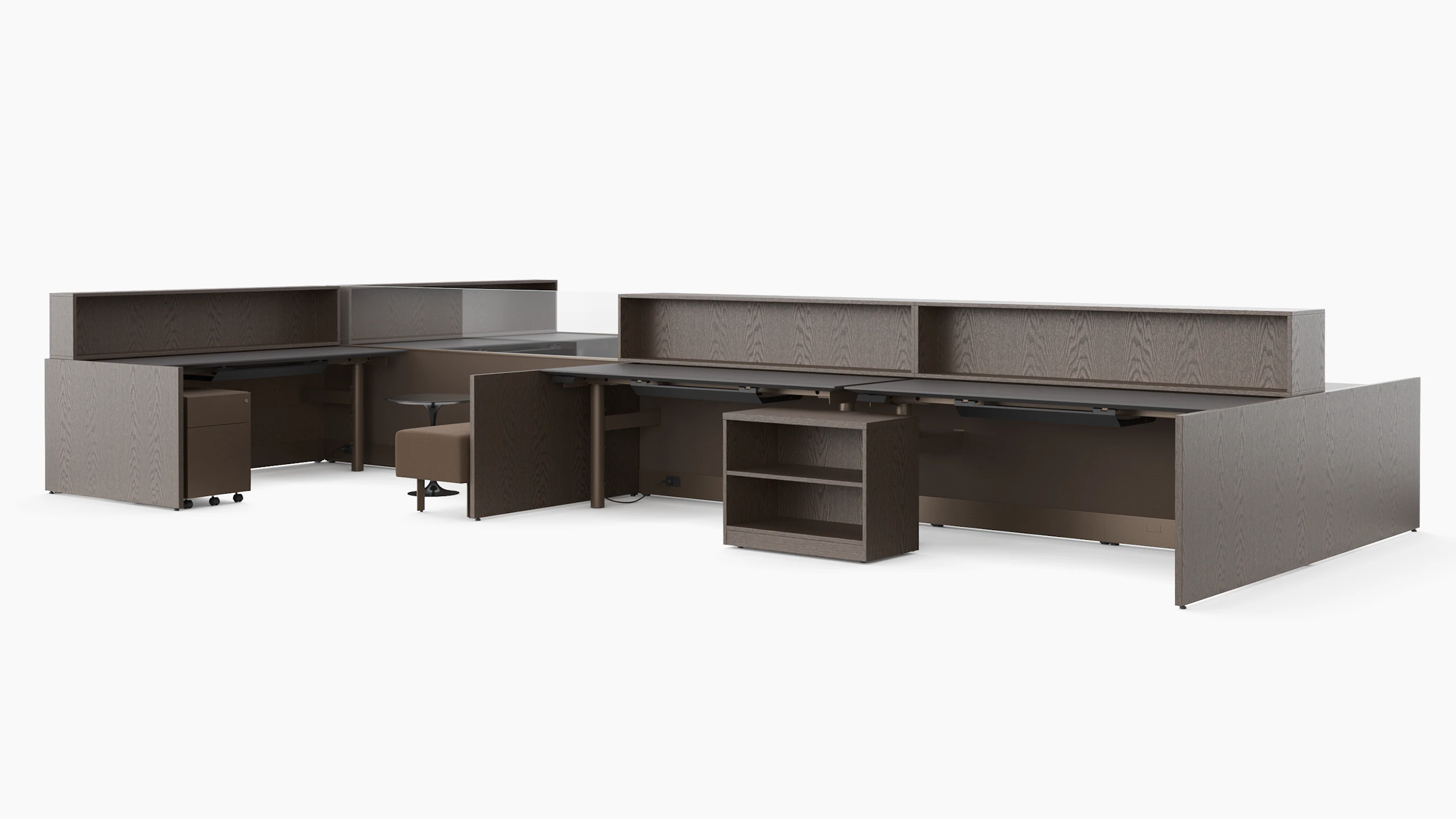 A group of workstations in dark finishes is viewed with several several configurations and accessories like guest benches, personal storage, occasional tables and personal storage.