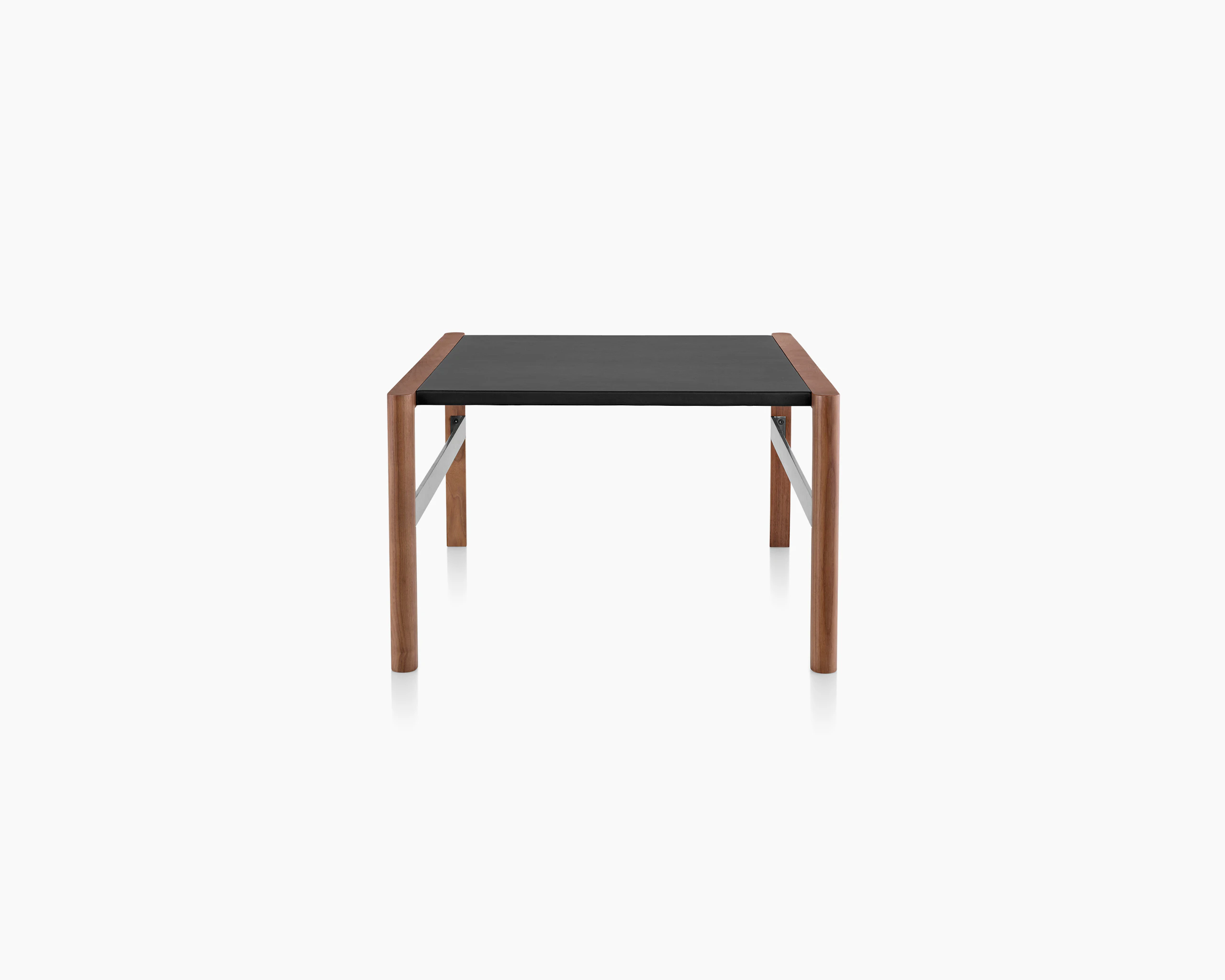 A Brabo side table with a black leather-wrapped top, walnut frame, and metal frame supports, viewed from the side.