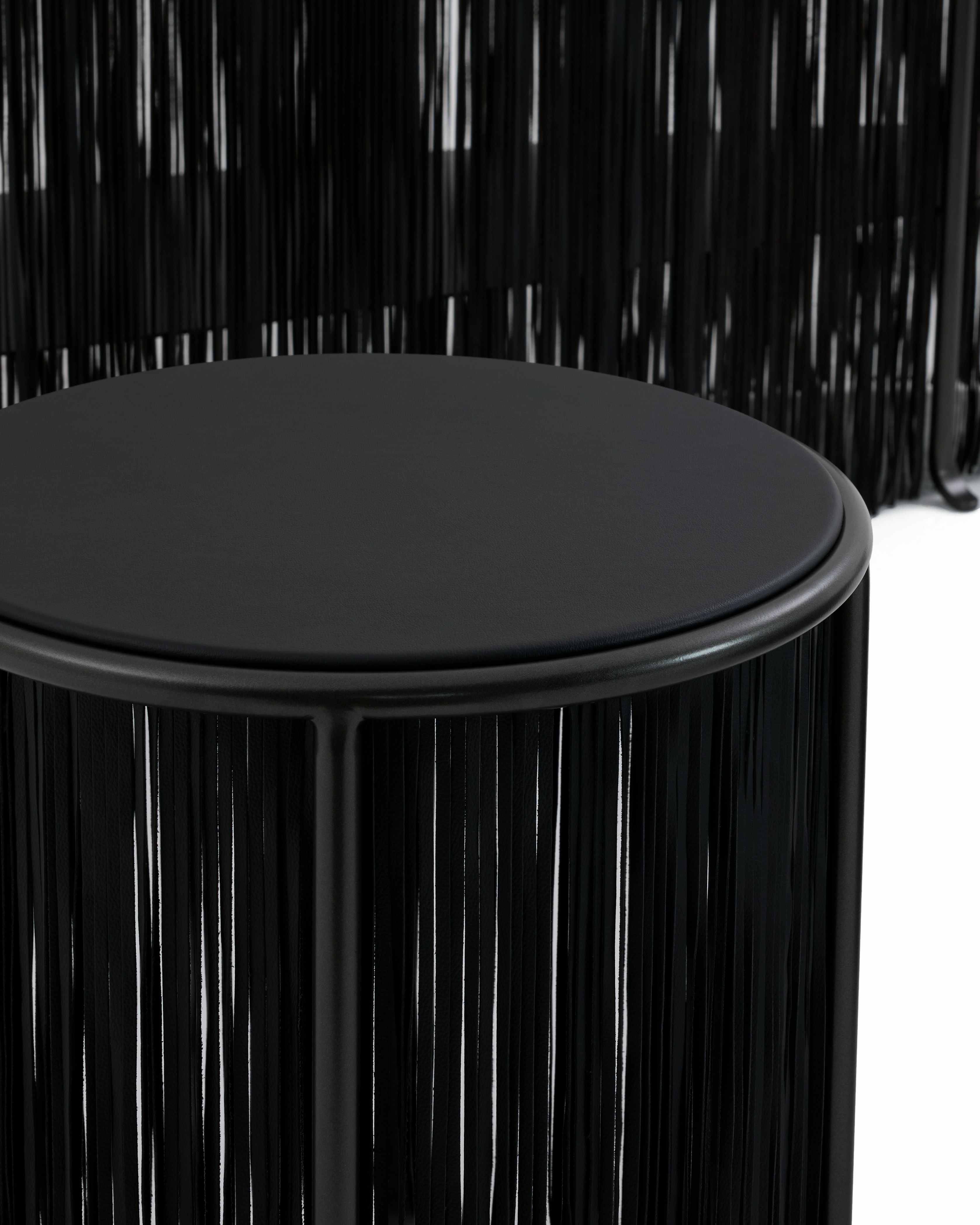 An environmental shot of a Dozie Side Table in Manganese Metallic.
