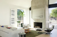 Kelston Sectional, Eames Lounge and Ottoman, Redaction Revisited - Version I by Gail Tarantino, Redaction Revisited - Version V by Gail Tarantino, Surf No. 28 by Cas Friese, Stemlite Floor Lamp, Huggy Swivel Chair, Ruti Moroccan Wool Rug, Risom Low Table