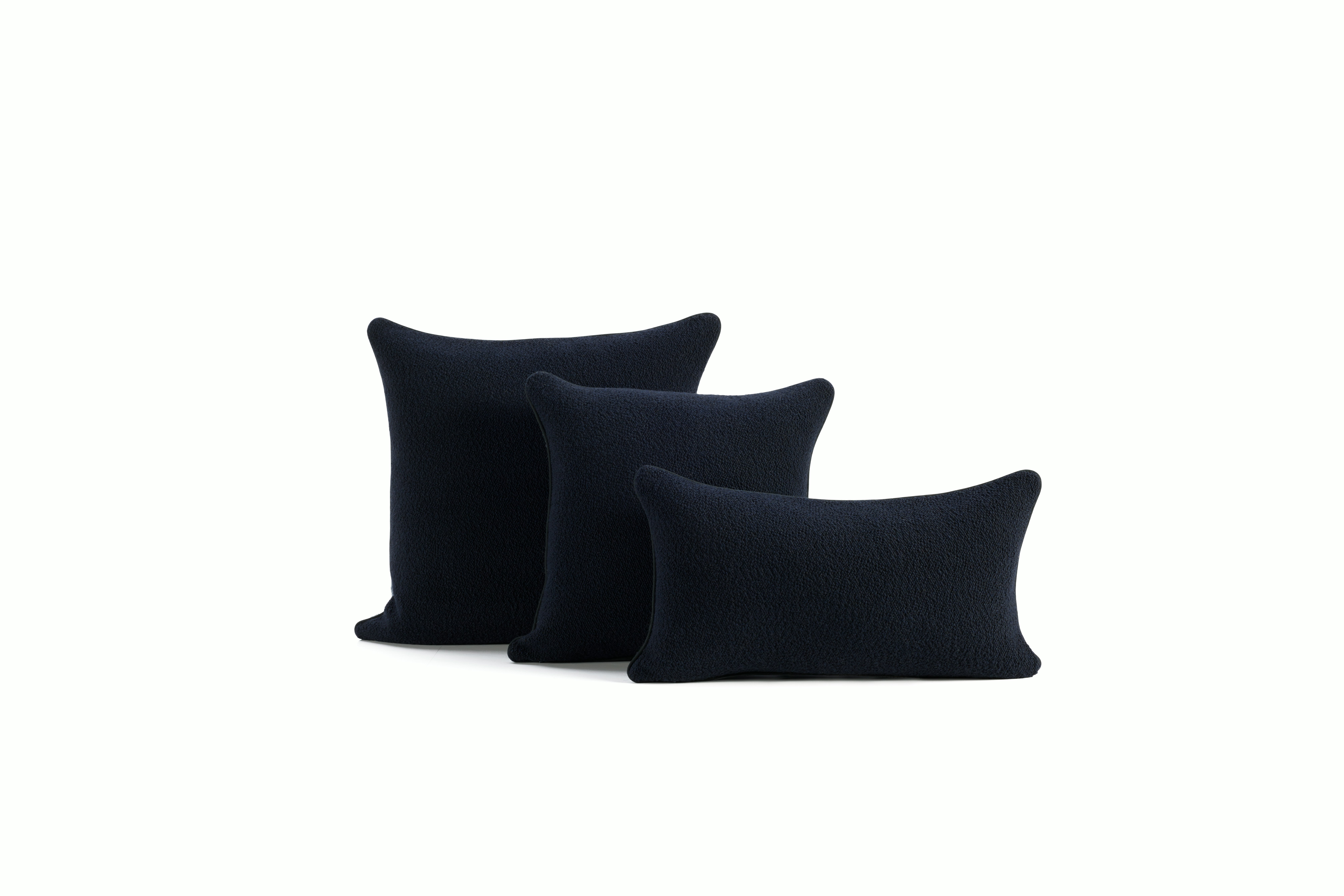 A detailed look at a Turf Color Blocked Pillow in Blue Grey Dark Blue.