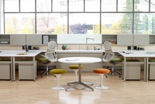 Dividends Skyline workstations with shared overhead storage and Generation chairs