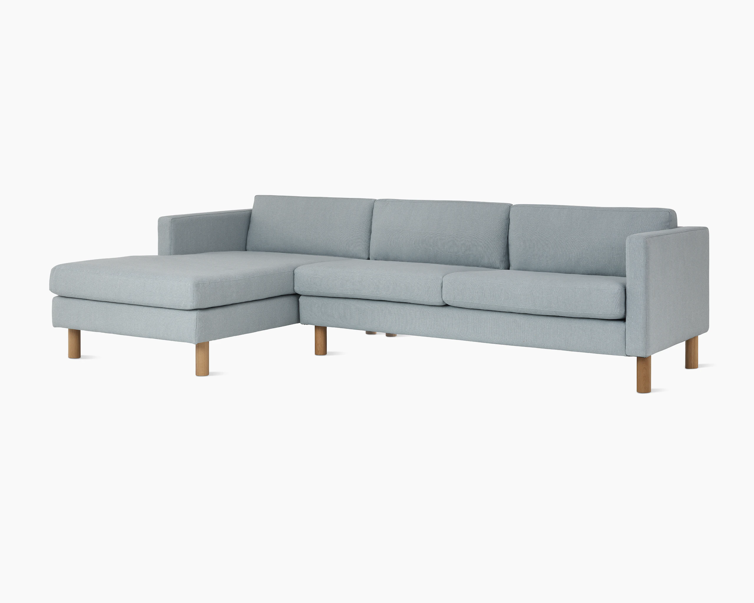 Lispenard Sofa with left chaise in light blue fabric upholstery, viewed from an angle.
