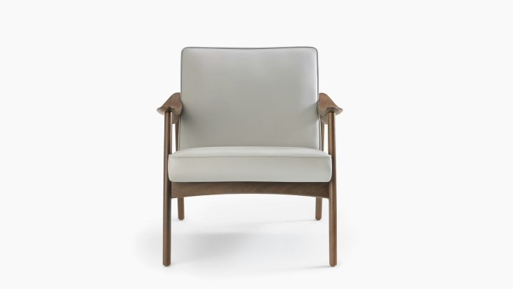 An Aspen Lounge Chair in a gray textile with walnut base and arms.