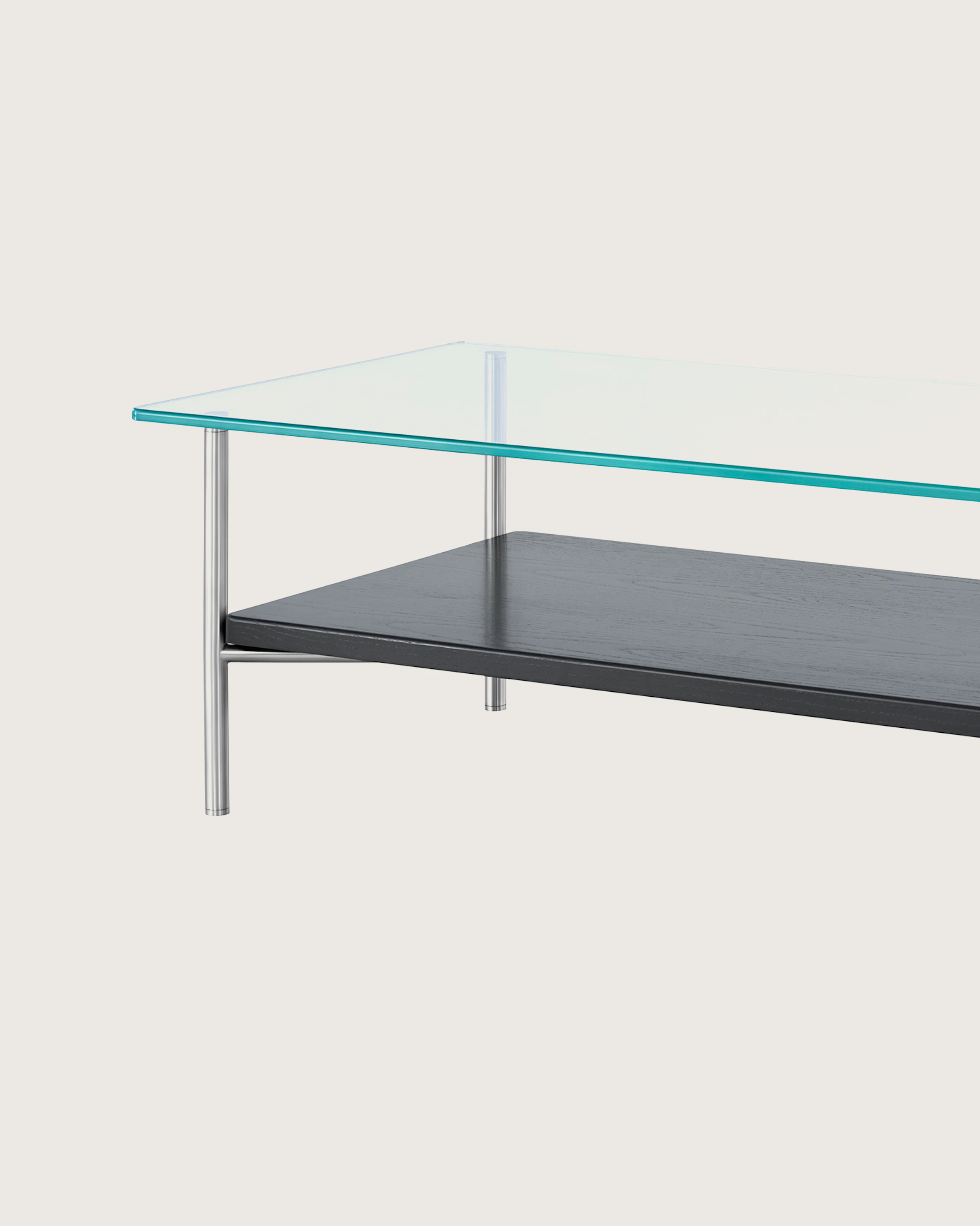 A rectangular Layer coffee table with a glass top and black lower shelf, viewed from an angle.
