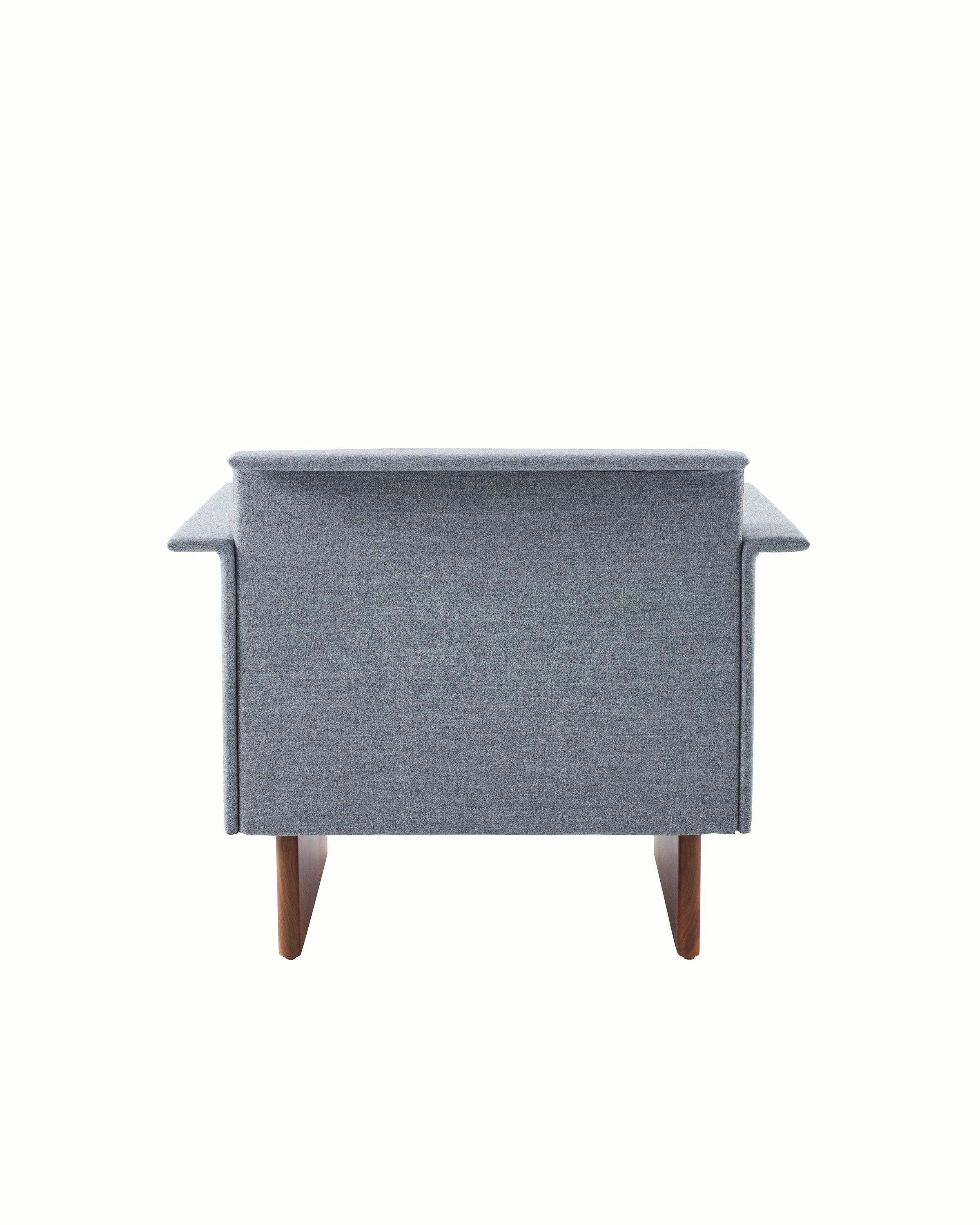 Mantle Club Chair in Panno di Dulce Flannel with a Walnut Base, viewed from the back.