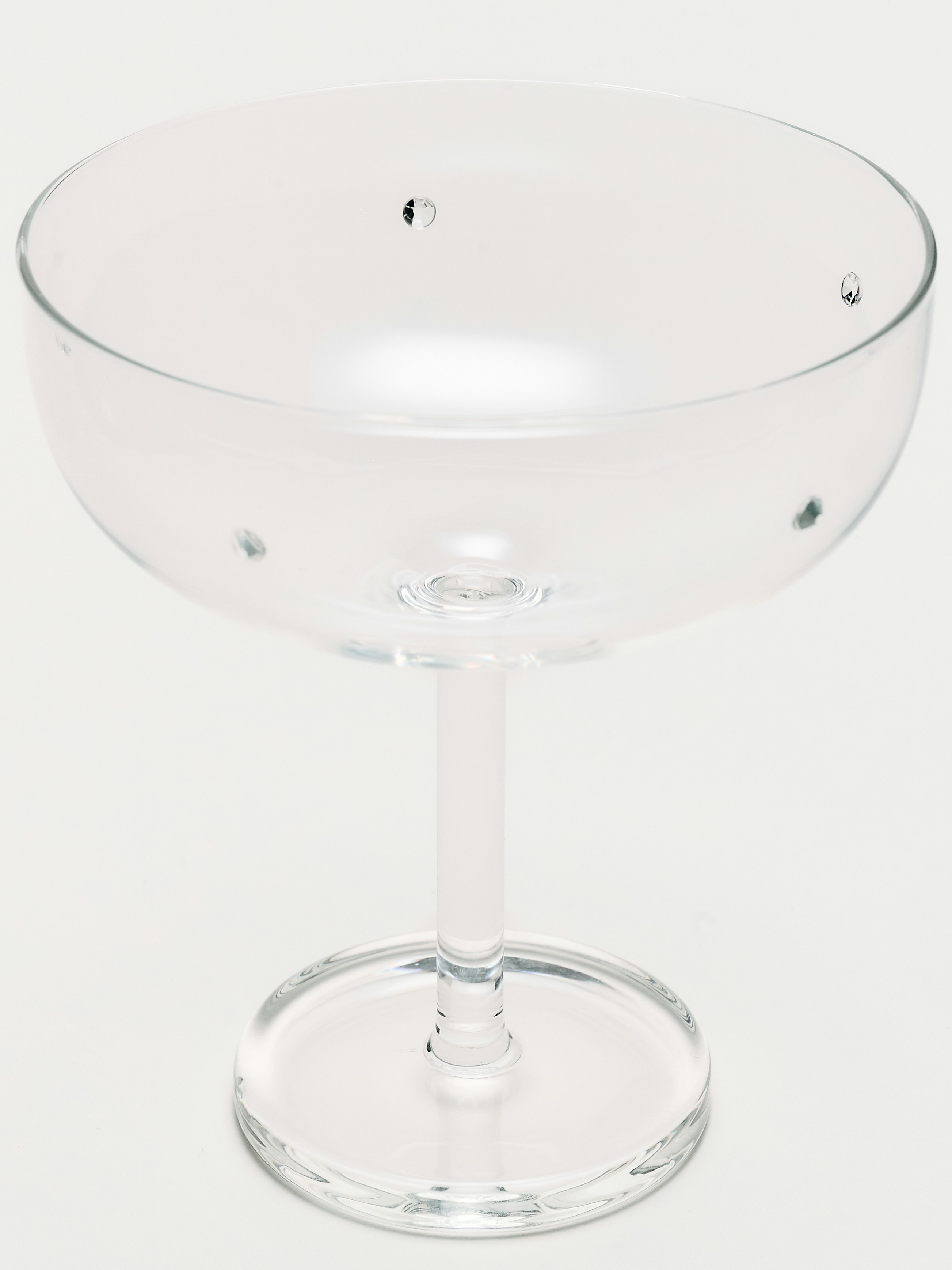 A Roma Coupe Glasses in Clear viewed from an angle.