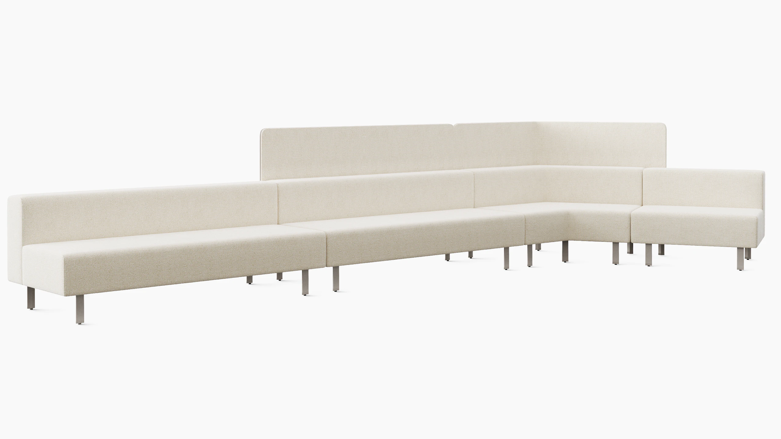 A large lounge bench is shown in a light upholstery. The bench has back and a 120 degree corner piece. There is a privacy screen attached to the back of the bench.
