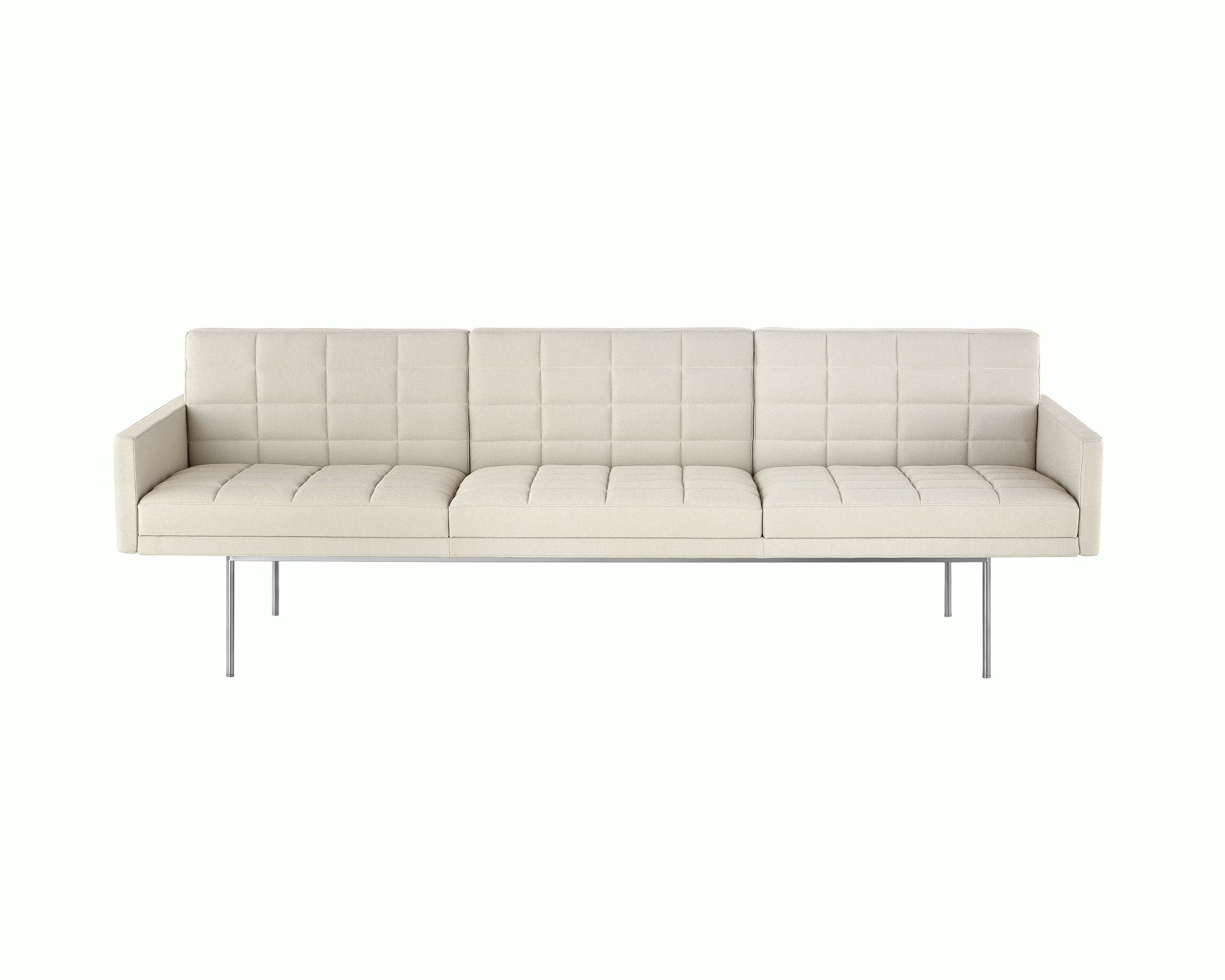 Partial front view of an ivory-colored Tuxedo Component sofa, showing the optional quilted upholstery.
