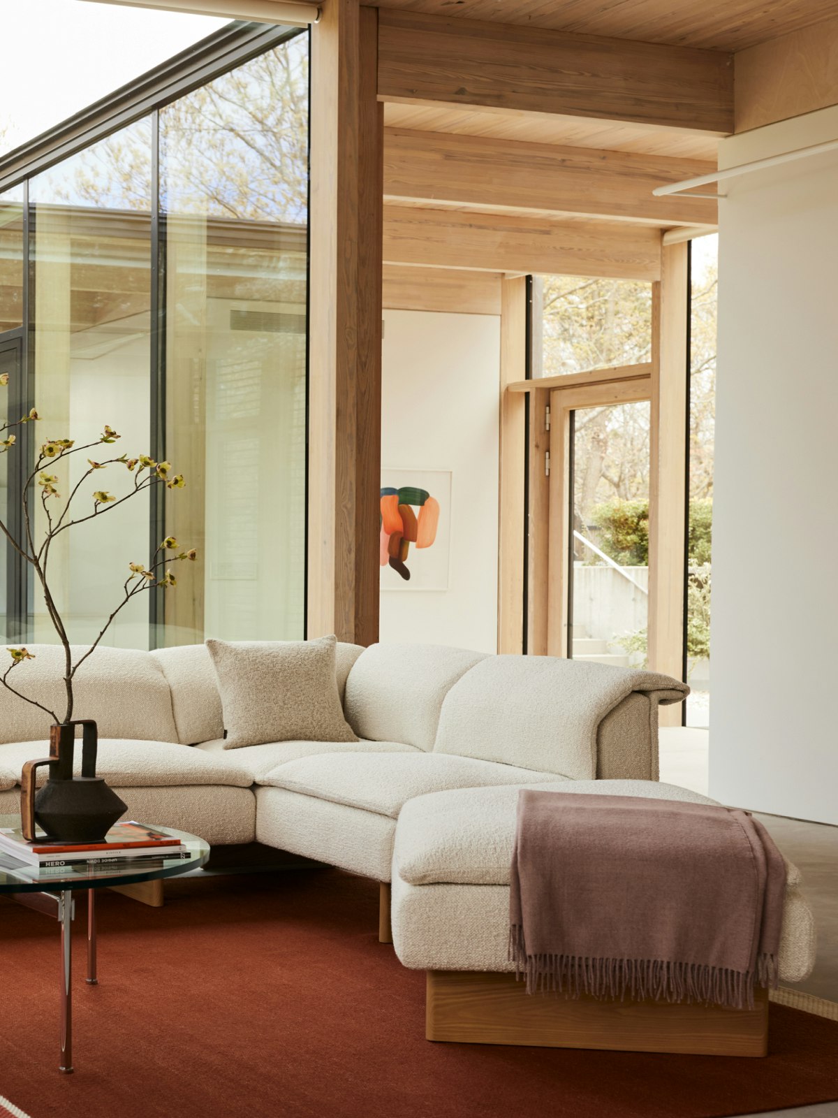 A Geiger residential setting with a Mantle Sectional Sofe and Claw Coffee Table.
