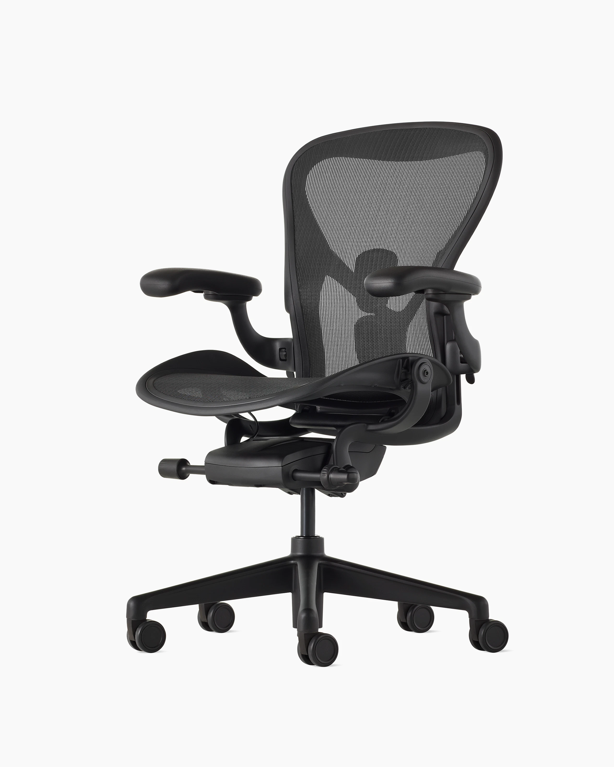 Black matte Aeron Chair on a white background with a 5-star base and ergonomic back support, viewed at an angle.