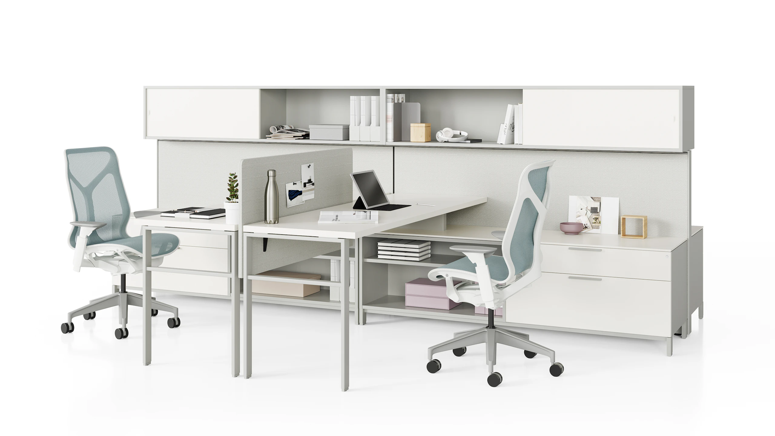 Two grey Canvas Wall workstations with white storage, surfaces, grey screens, and light blue Cosm Chairs.