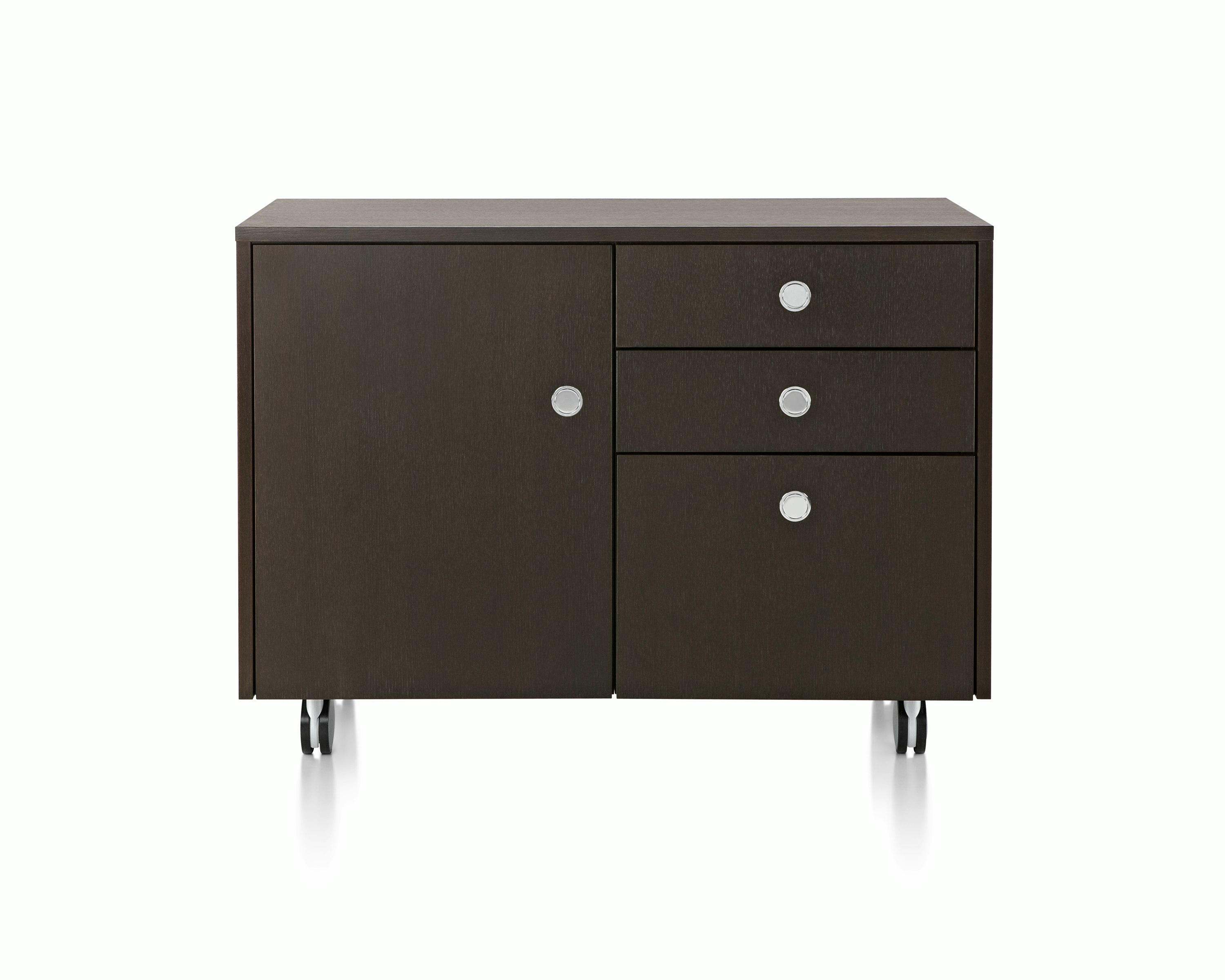 Partial view of a Sled Base Storage unit with a dark wood finish, showing four flush-mounted Flip pulls.