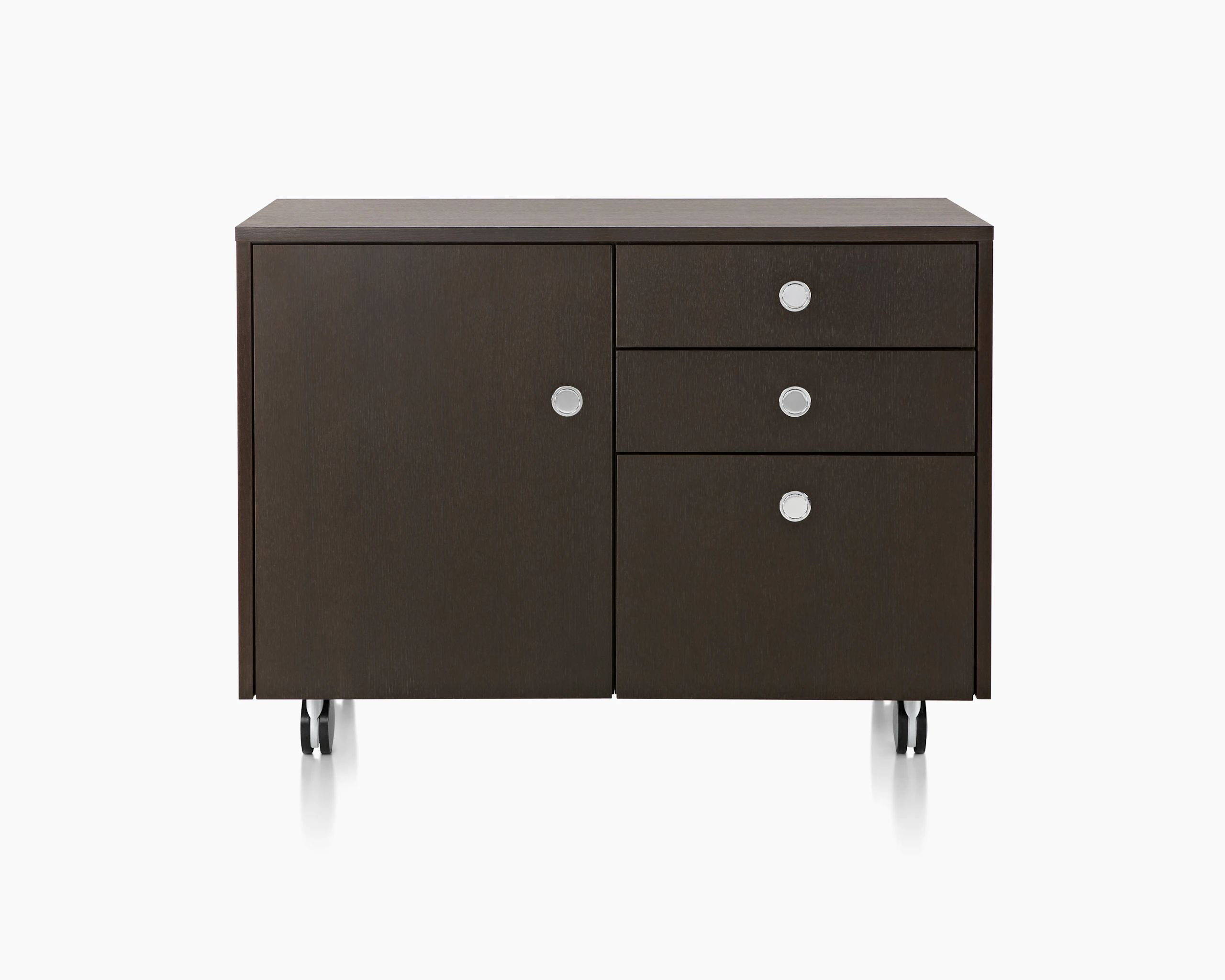 Partial view of a Sled Base Storage unit with a dark wood finish, showing four flush-mounted Flip pulls.